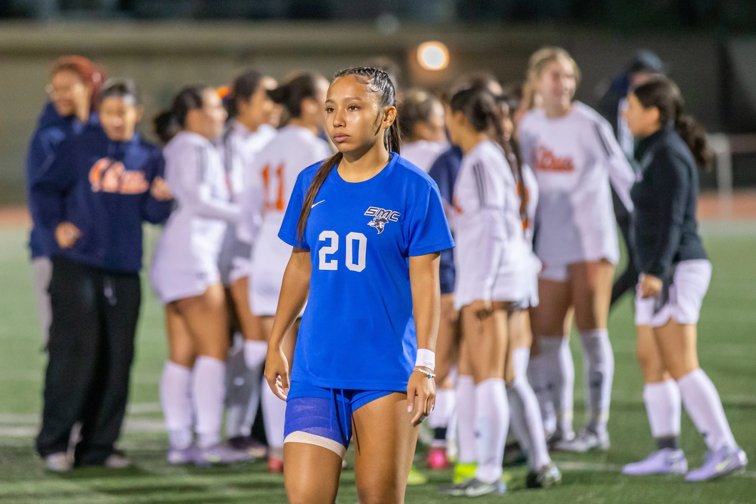  Santa Monica College (SMC) Corsair middle Kobe Aguliar (#20) walk past Citrus College Owls celebrating after defeating the Corsairs in a penalty shoot out after the first match of the California Community College Athletic Association (3C2A) Champion