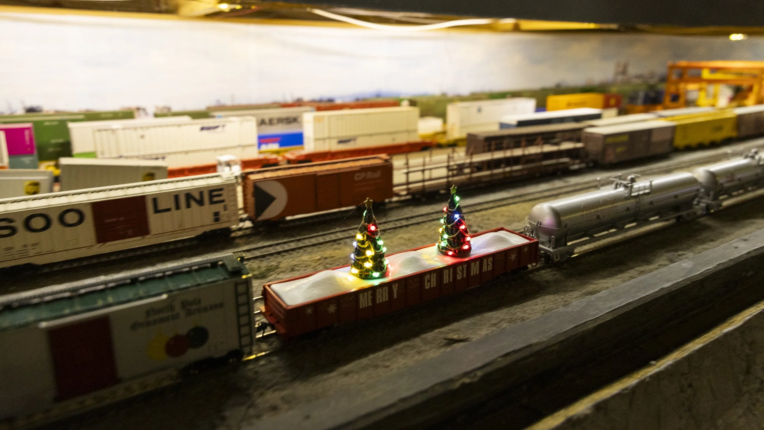  A model train car adorned with Christmas trees at the Christmas Tree Lane Model Train House during the 105 Christmas Tree Lane lighting ceremony in Altadena, Calif., on Saturday, Dec. 8, 2025. The model train house features a wide variety of model t