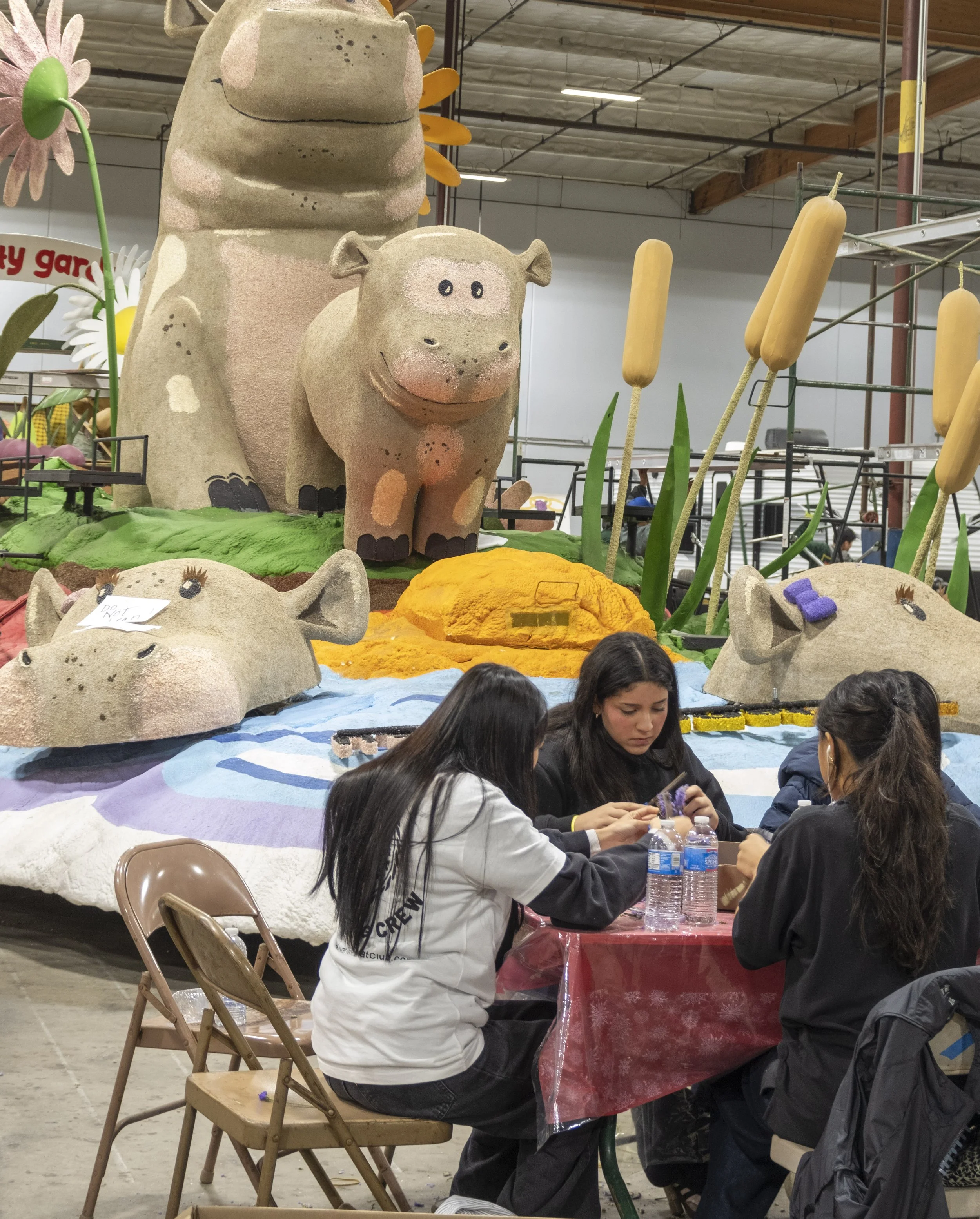  Workers gather in a warehouse in Irwindale, Calif. to decorate Rose Parade floats on Friday, Dec. 26, 2025. (The Corsair | Fai Fong) 