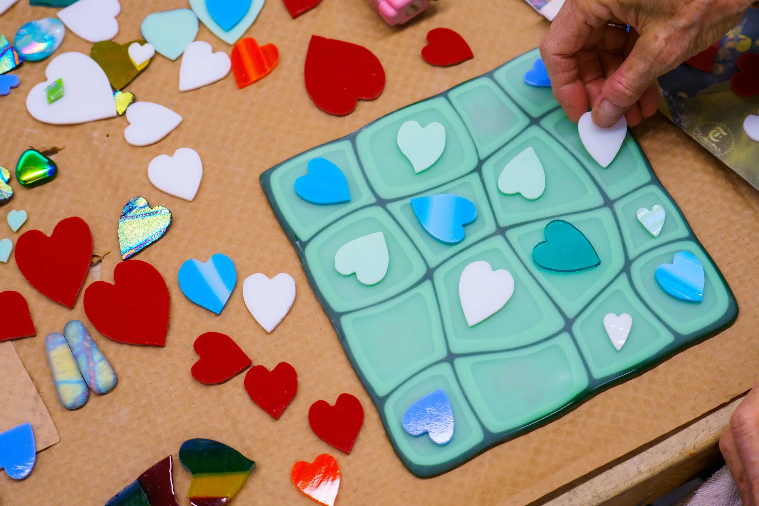  Santa Monica College (SMC) Community Education glass fusing artist Denise Bachman works on a Valentine's Day themed piece for an upcoming Valentine's Day Glass Sale at SMC Art Complex in Santa Monica, Calif. on Friday, Jan. 30, 2026. The winter sess