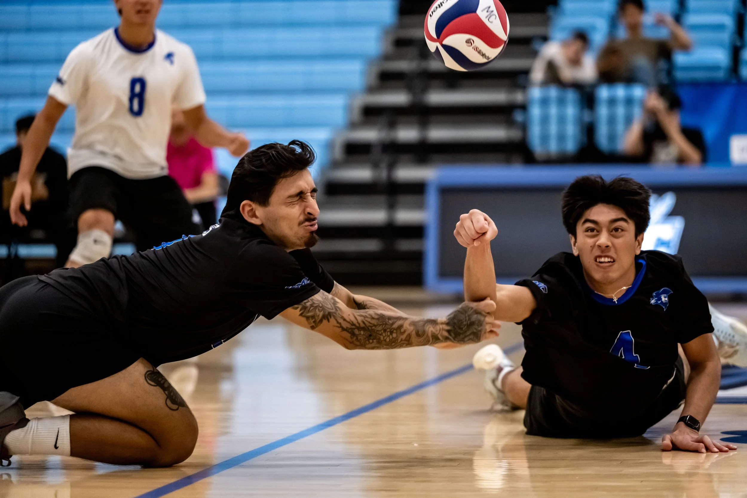  Santa Monica College Corsairs (L) Ryan Montero (18) and (R) RJ Carroll (4) dive for the ball to keep the rally going during their match with Moorpark City College Raiders in Moorpark, Calif., on Friday, Feb. 27, 2026. The Corsairs won the match 3 se