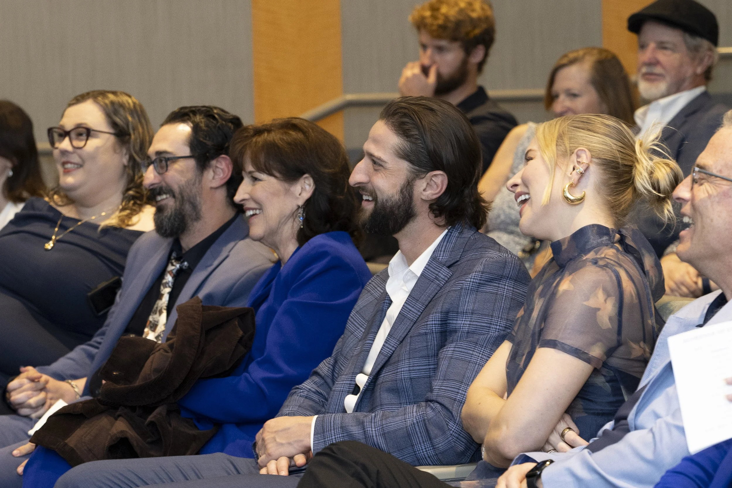  (L_R) Blue Fier’s close family, Elyse and Zack Reed Fier, his oldest son, Fier’s wife Kim Saunders, and his younger son Easton and Kendall Fier laughing about a shared memory during the Memorial Service on Saturday, Feb. 28, 2026, at SMC Main campus
