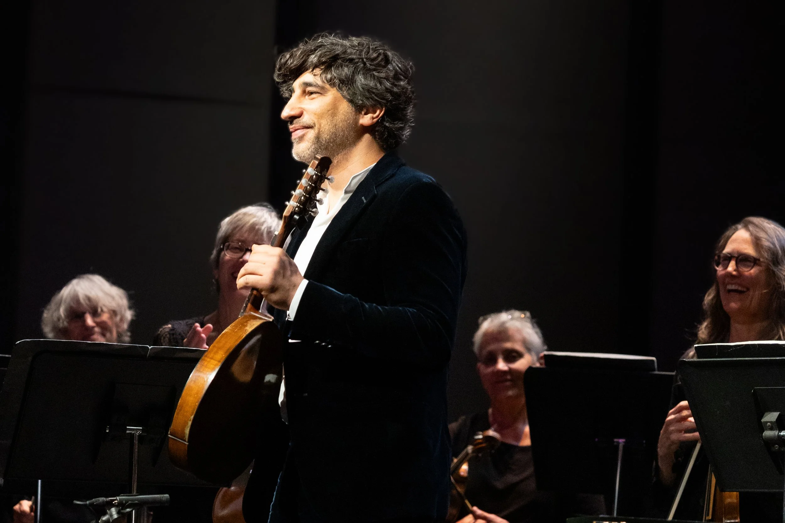  Grammy nominated mandolinist Avi Avital (center) faces the audience following his second encore, his version of “Bučimiš”, during a performance with Philharmonia Baroque Orchestra on Sunday, February 22, 2026, at BroadStage in Santa Monica, Calif. (