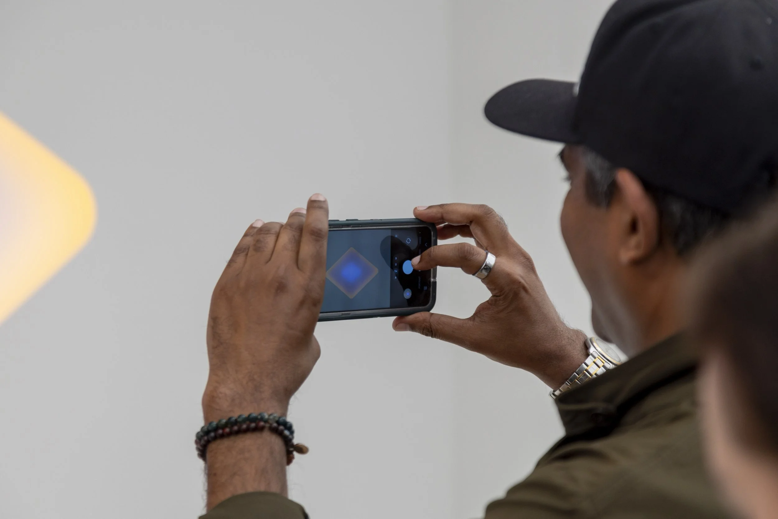  An attendee takes a picture of a piece of artwork with his cellphone, Friday, Feb. 27, 2026, at the Frieze Los Angeles art fair in Santa Monica, Calif. Beyond just being an event for galleries and collectors to purchase art, paying attendees also vi