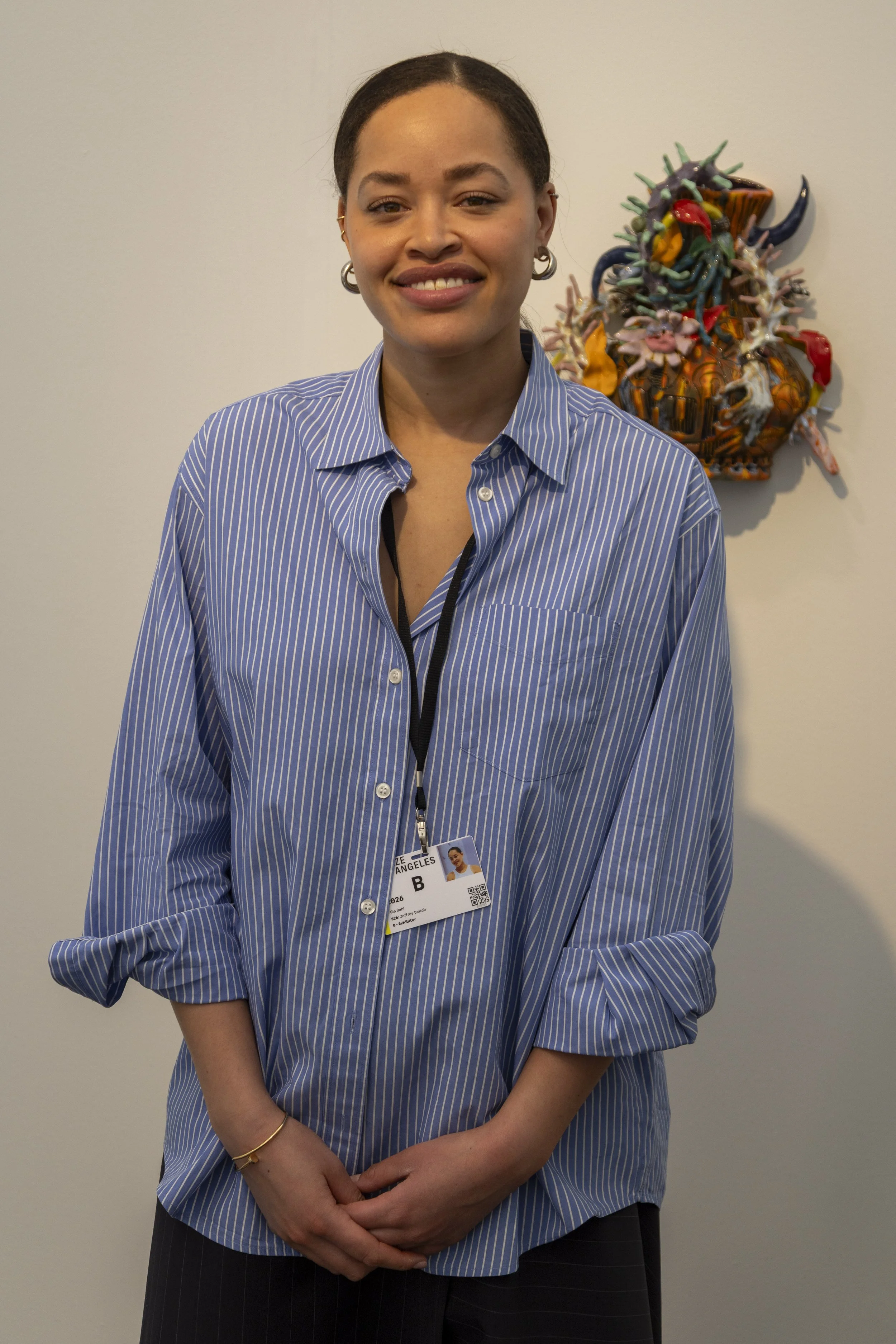  Alia Dahl (cq), a representative of Jeffrey Deitch Gallery, poses for the camera in their booth at the Frieze Los Angeles art fair in Santa Monica, Calif., Friday, Feb. 27, 2026. Jeffrey Deitch brought a collection of ceramic sculpures by artist and