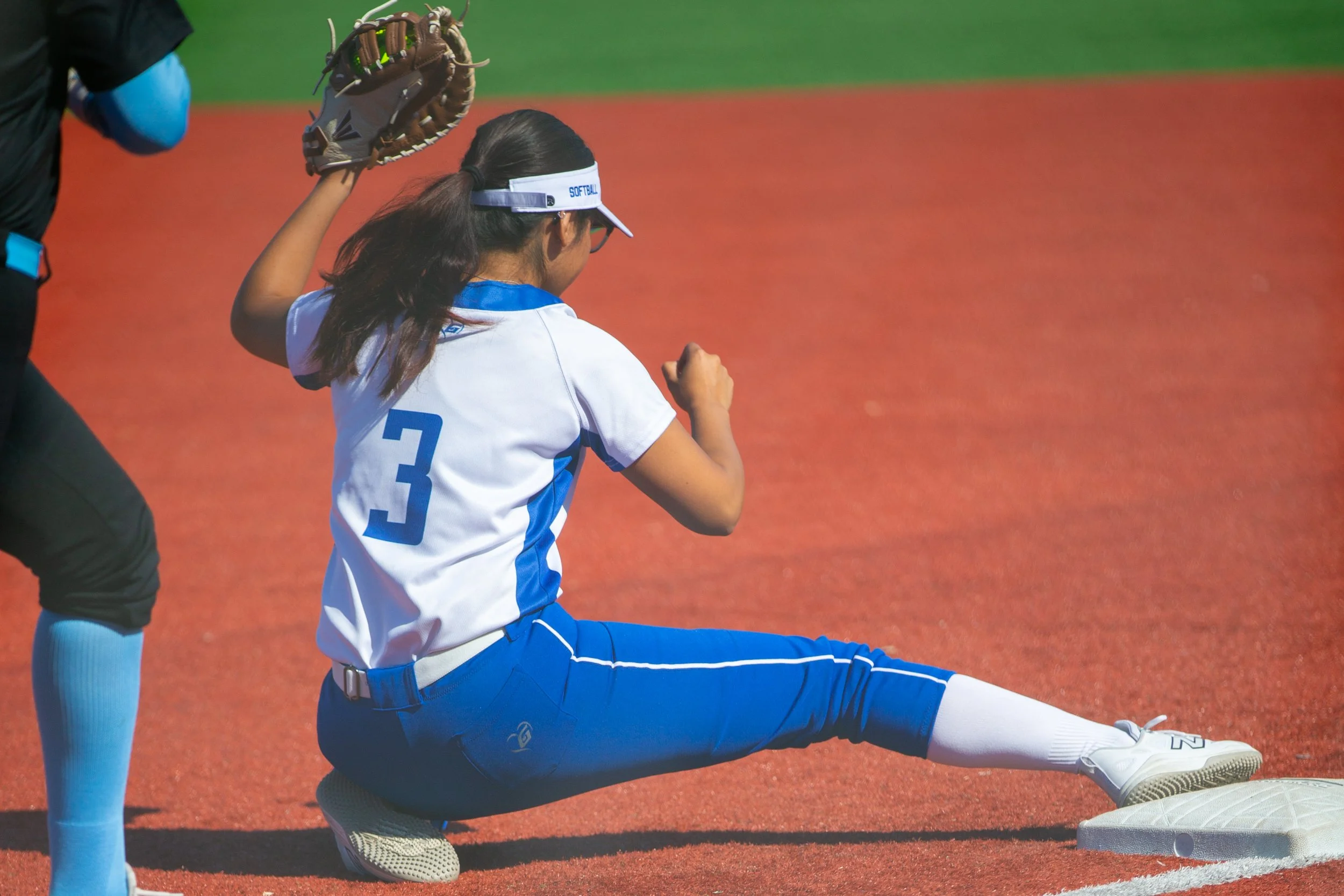  Santa Monica College (SMC) Corsair first baseman/outfielder Dayanara Velazquez (CQ) (#3) getting a Moorpark College Raiders player out on first base during a match at John Adams Middle School Softball Field, Santa Monica, on Wednesday, March 10, 202