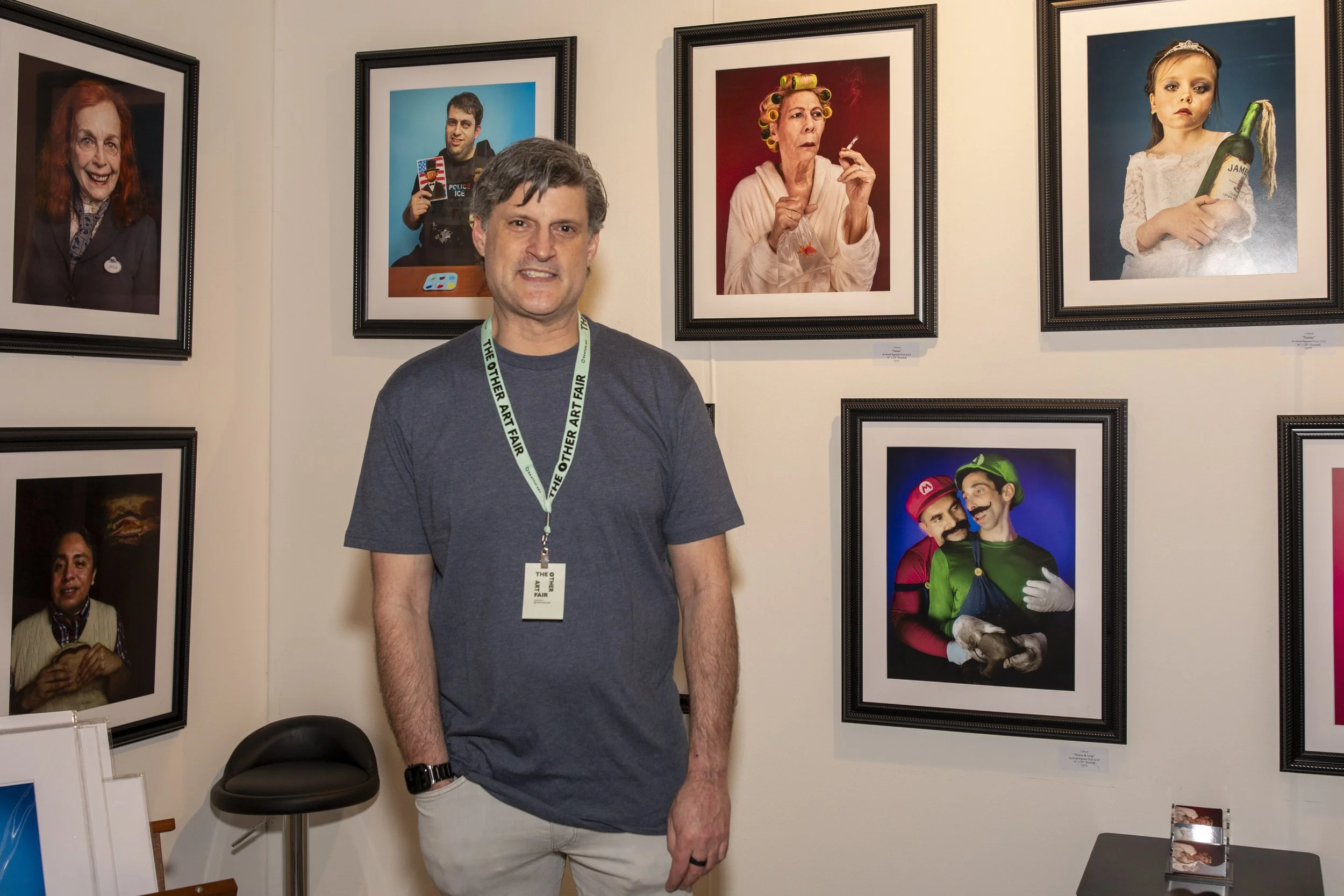  Artist Jason Ward stands in front of his work during opening night at The Other Art Fair in Culver City, Calif. Thursday, Febuary 27, 2026. Ward says he is worried about the future of AI in the art world, but appreciates it in other areas for advanc