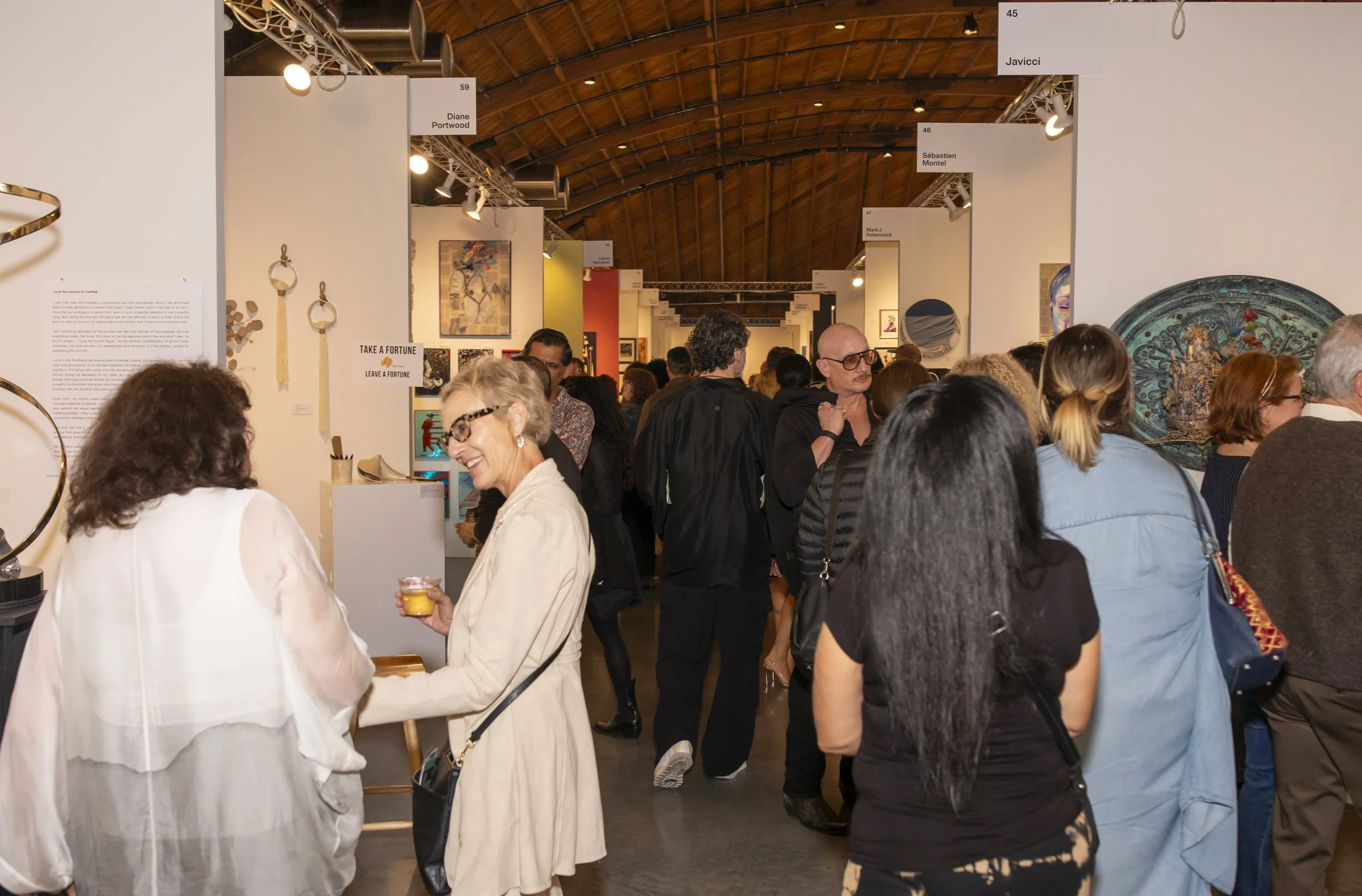 Art patrons explore and socialize with the artists and guests at the opening night of The Other Art Fair in Culver City, Calif. Thursday, Febuary 27, 2026 (Andrew Starnes | The Corsair) 