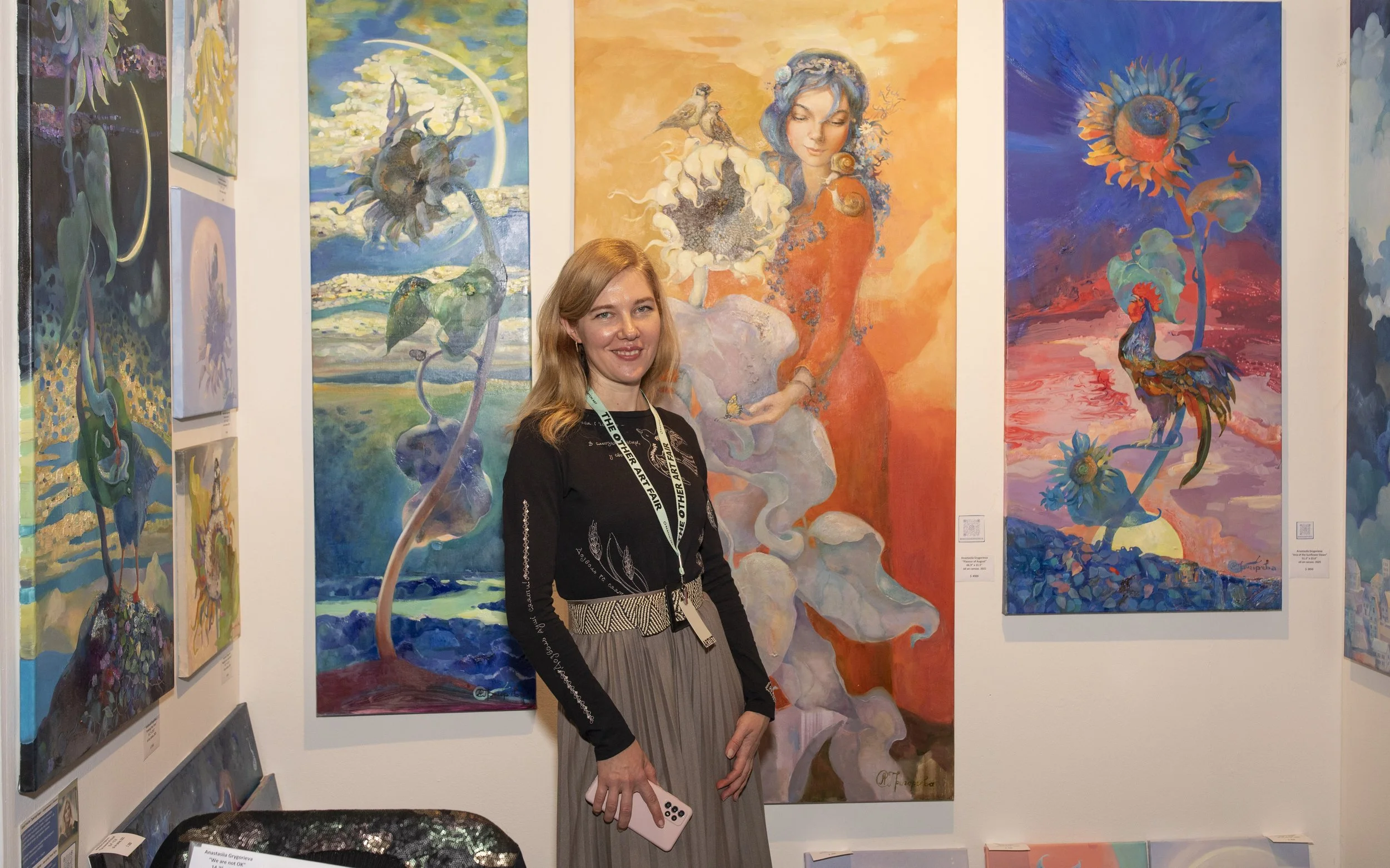  Artist Anastasiia Grygorieva (cq) from Ukraine, stands in front of her work she has been painting during the war, at the opening night of The Other Art Fair in Culver City, Calif. Thursday, Febuary 27, 2026  (Andrew Starnes | The Corsair) 