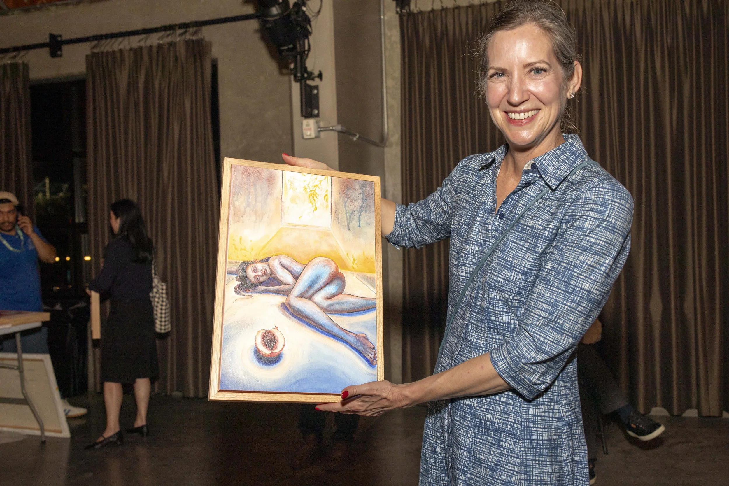  Holly Culbreth with the painting she just purchased at the opening night of The Other Art Fair in Culver City, Calif. Thursday, Febuary 27, 2026  (Andrew Starnes | The Corsair) 
