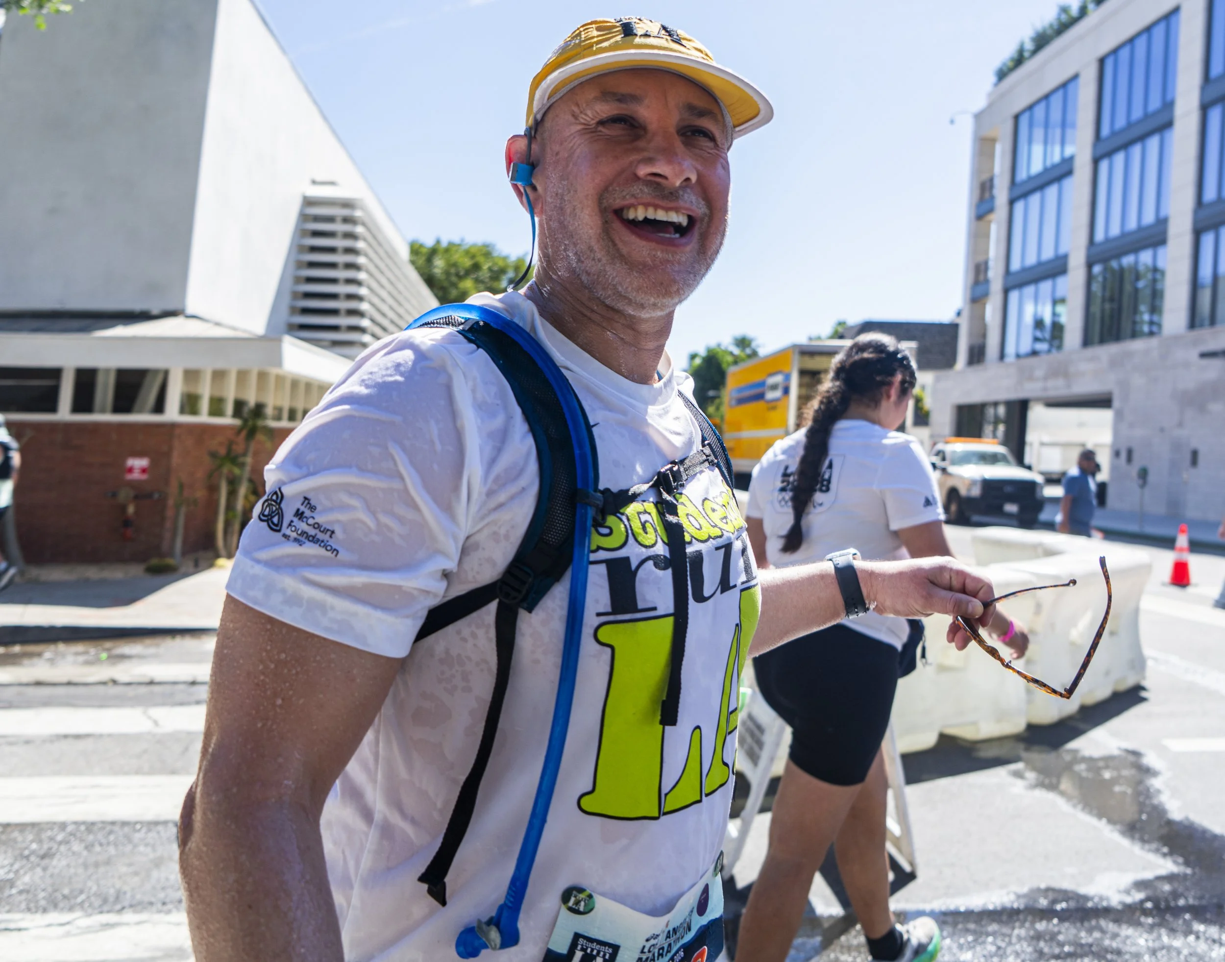  Los Angeles Marathon runner dripping wet laughs happily after receiving refreshment at mile 17 cool down water station at the cross streets of Charleville Blvd and Santa Monica Blvd at the 41st annual LA Marathon on Santa Monica Blvd in Beverly Hill