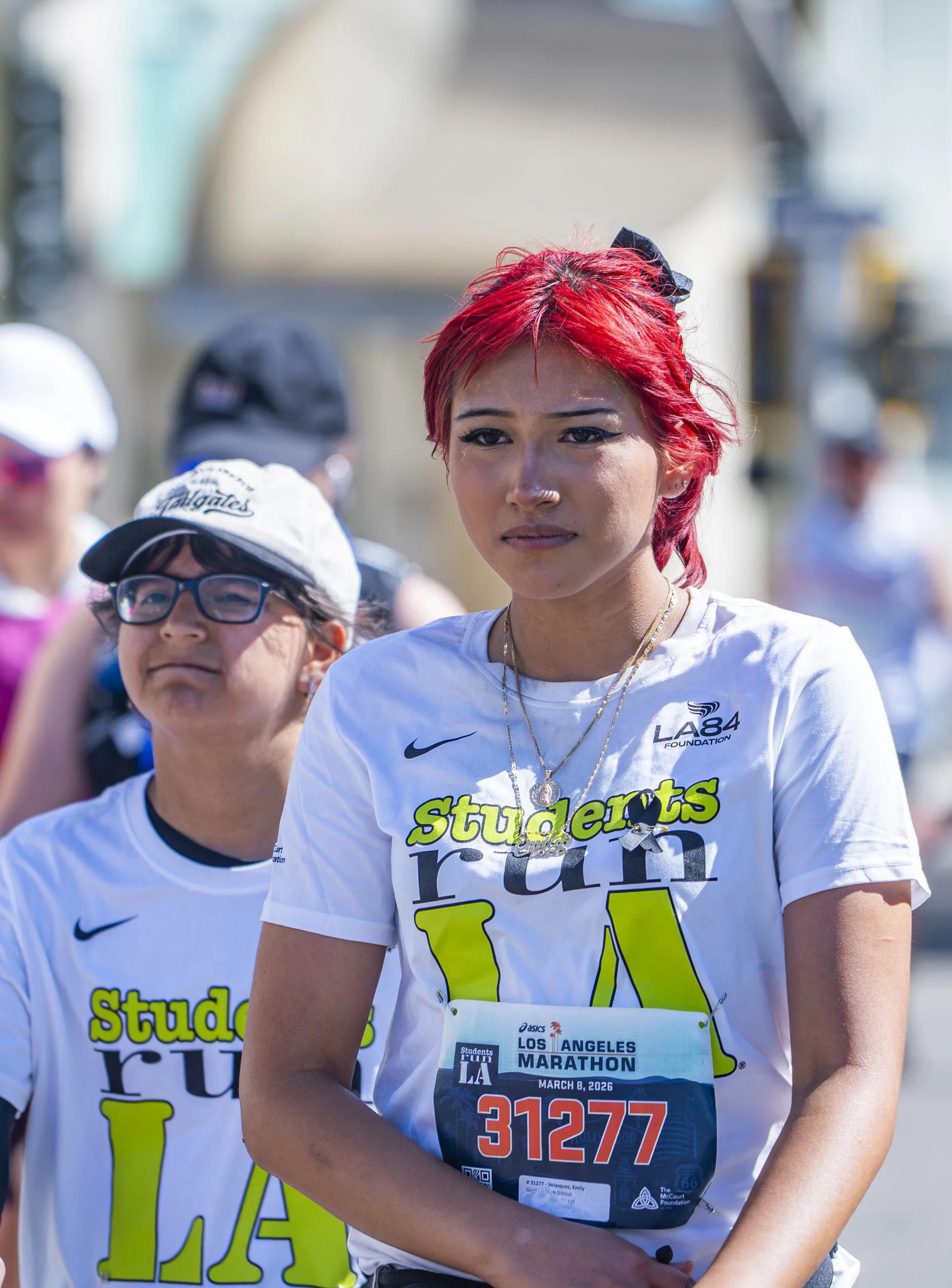 Members of Students Run LA at the 17 mile mark of the 26.2 mile race approach Santa Monica Blvd. at Wilshire Blvd. during the 41st annual Los Angeles Marathon in Beverly Hills, Calif., on Sunday, March 8, 2026. (Danny Sanchez | The Corsair) 