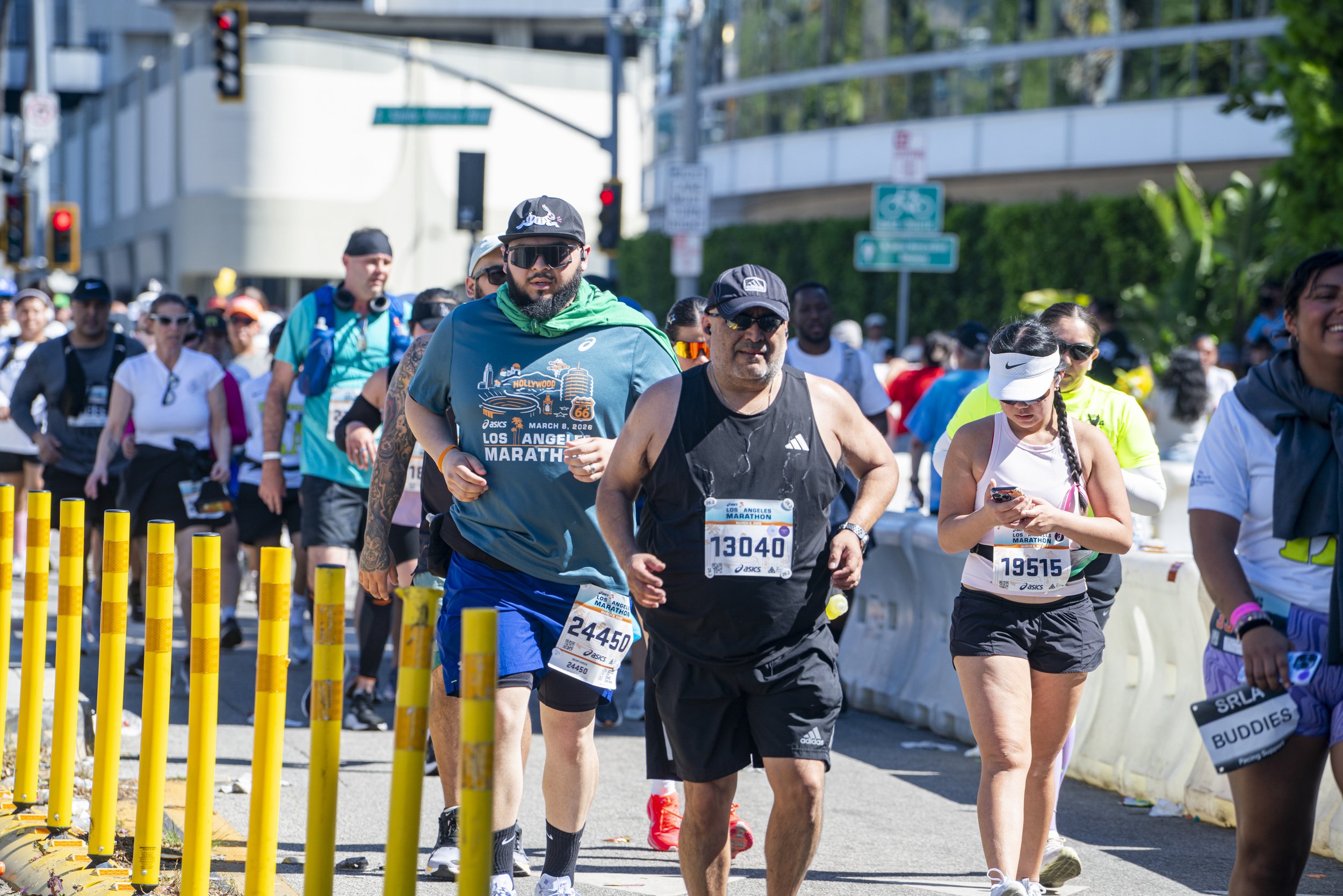  Los Angeles Marathon runners just pass mile 16 of the 26.2 mile race bend around the intersection of Wilshire Blvd on to Santa Monica Blvd at the 41st annual LA Marathon on Santa Monica Blvd in Beverly Hills, Calif., Sunday, March 8, 2026 (Danny San