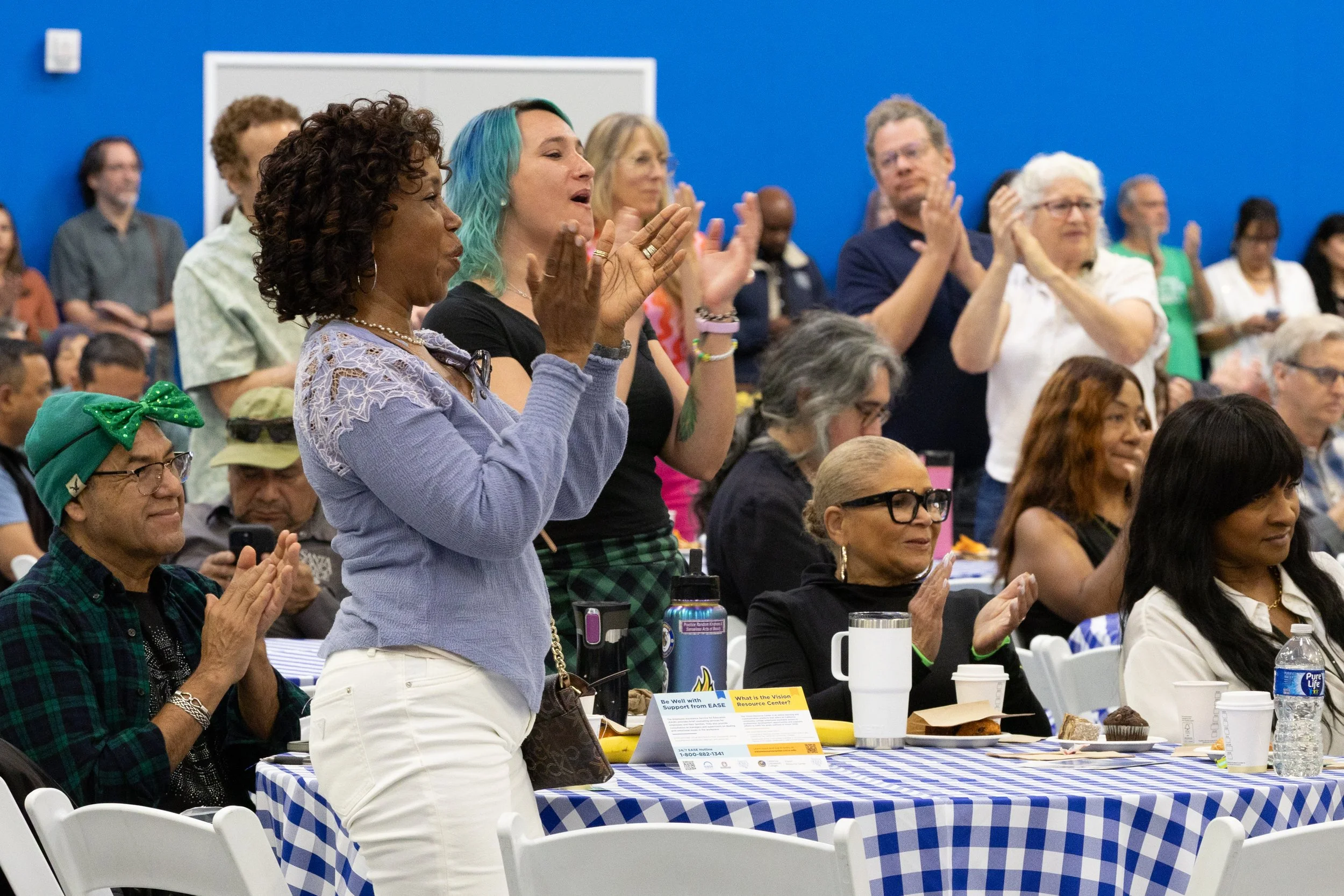  Santa Monica College’s (SMC) faculty and staff give a standing ovation to the SMC Melanated Roots Student Choir after their performance during the SMC Spring 2026 Professional Development Day with the theme “Rooted in Progress: Essential Tools for G