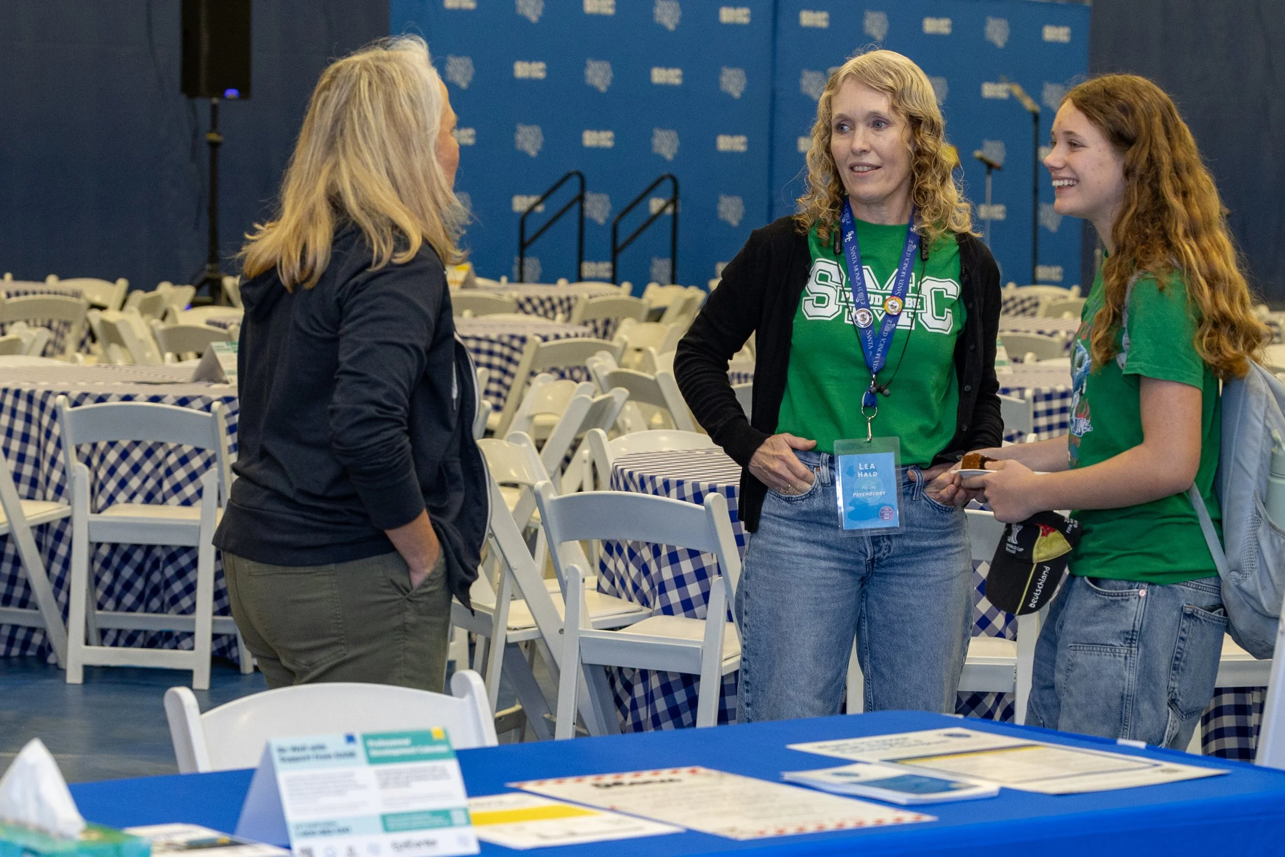  Lea Hald (center), a Psychology professor and activity organizer of the Santa Monica College’s (SMC) Spring 2026 Professional Development Day with the theme “Rooted in Progress: Essential Tools for Growth”, speaks alongside her daughter with a colle