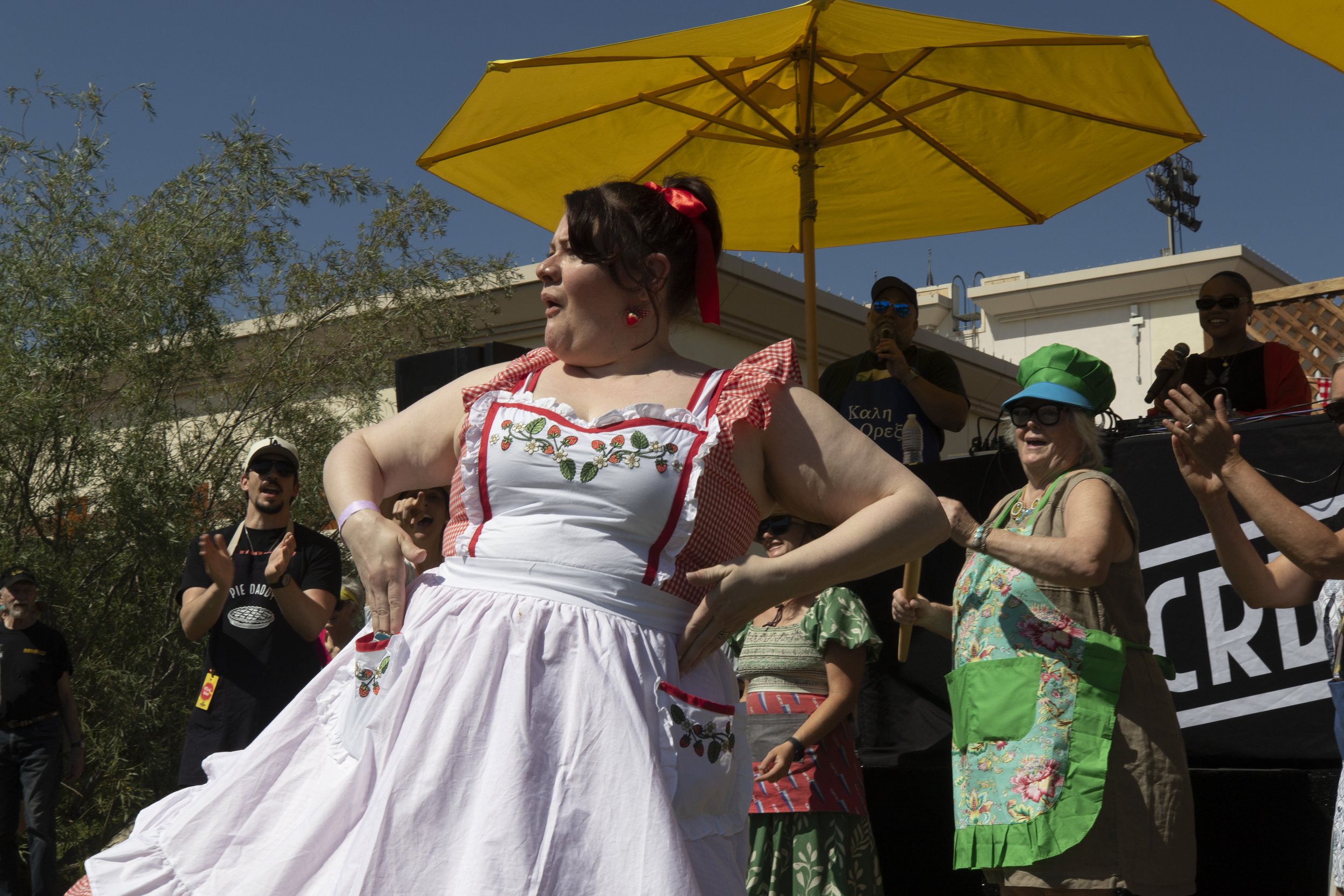  Pie enthusiasts show off their aprons in a fashion show contest for swag at the 12th Annual Pie Fest & Contest was hosted by KCRW on Saturday, Mar. 14, 2026 at The Autry Museum in LA, Calif. KCRW DJ Steve Chiotakis (cq) emcee'd the apron fashion sho