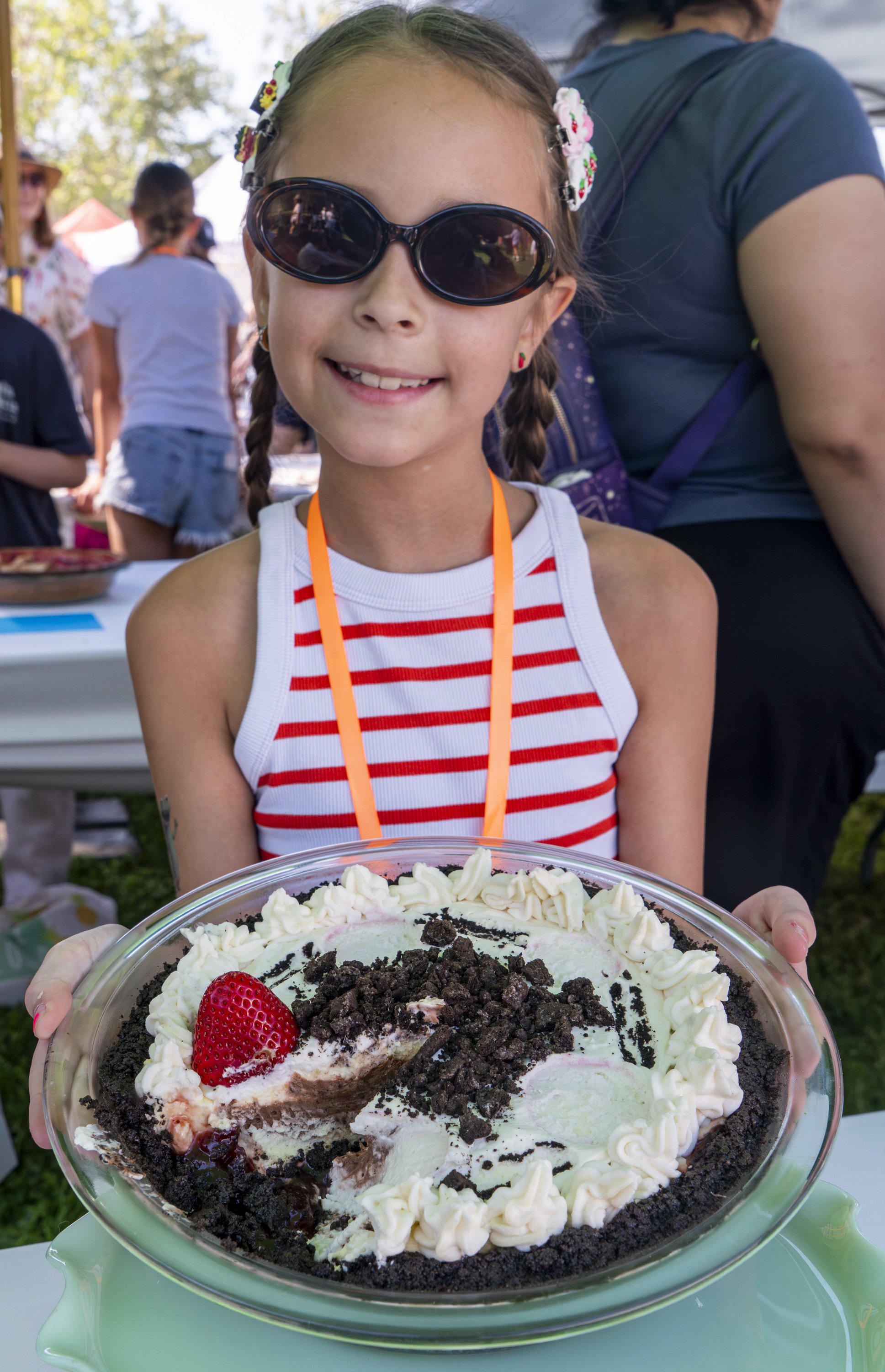  8 Year old Junior Baker contestant Zuzie James presents a "Bloody Zebra Pie" a personal recipe of hers at the 12st annual KCRW Pie Fest & Contest at the Autry Museum in Giffith Park, Los Angeles Calif., Saturday, March 14, 2026 (Danny Sanchez I The 