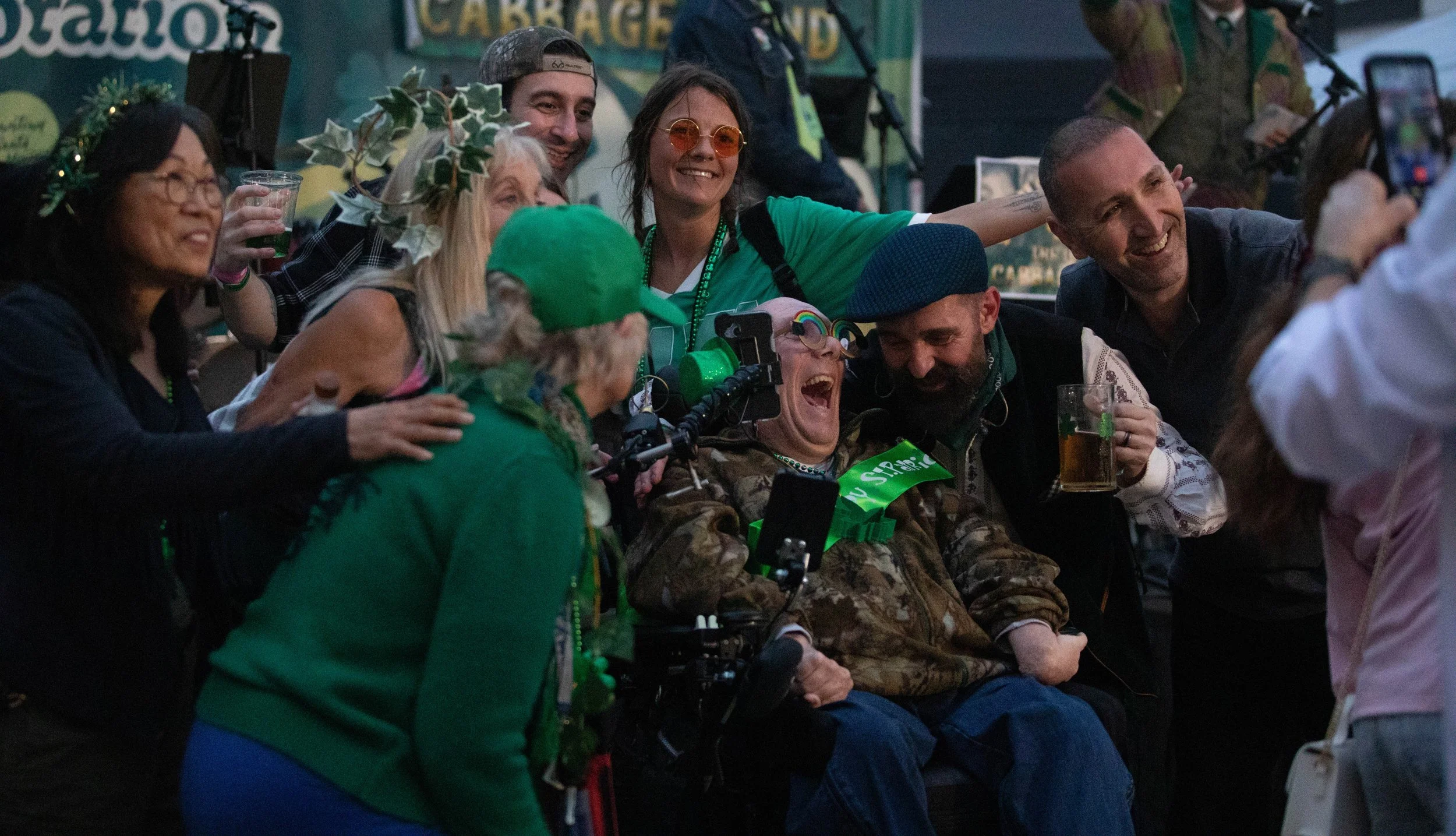  A sizable crowd of partygoers pose for a group photo with the lead singer of Shamrock Sean and The Irish Cabbage Band at the St. Paddy's Day Celebration on the Promenade on March 14, 2026 on Third Street Promenade in Santa Monica, CA. (Maria Lebedev