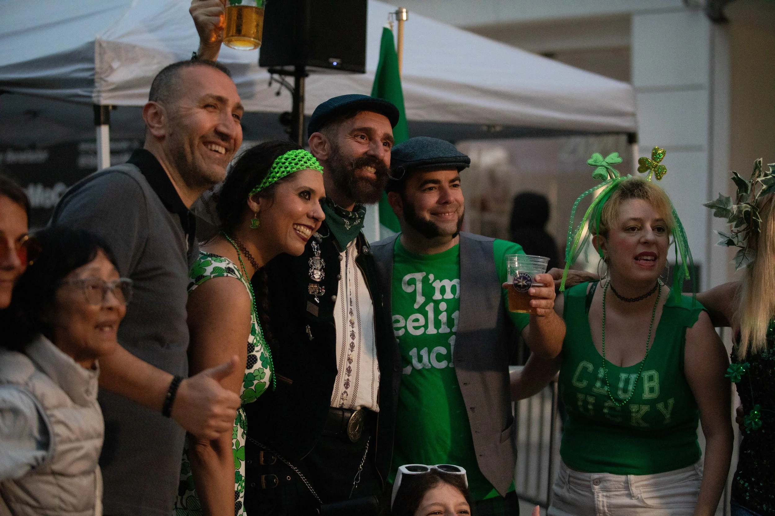  A sizable crowd of partygoers pose for a group photo with the lead singer of Shamrock Sean and The Irish Cabbage Band at the St. Paddy's Day Celebration on the Promenade on March 14, 2026 on Third Street Promenade in Santa Monica, CA. (Maria Lebedev