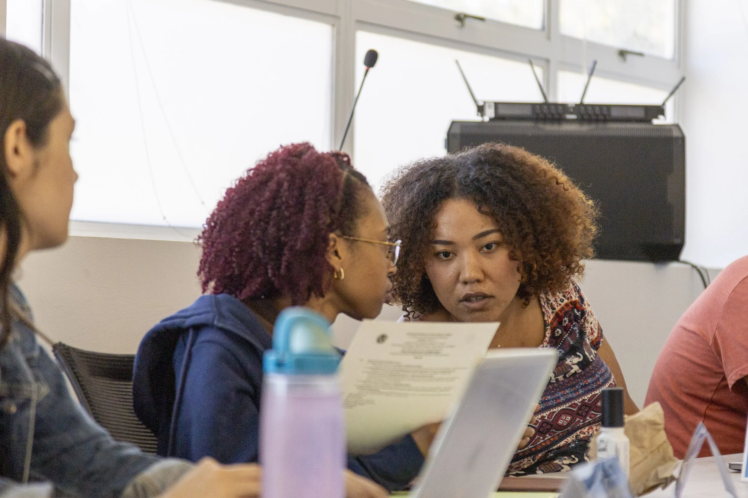  Santa Monica College (SMC) Associated Students (AS) Director of Budget Management Paula Cortes Hernandez (cq) shows Director of Equity and Diversity Maliyah Ponce (cq) (left to right) a document during the AS Board Meeting, Friday, March 20, 2026 on