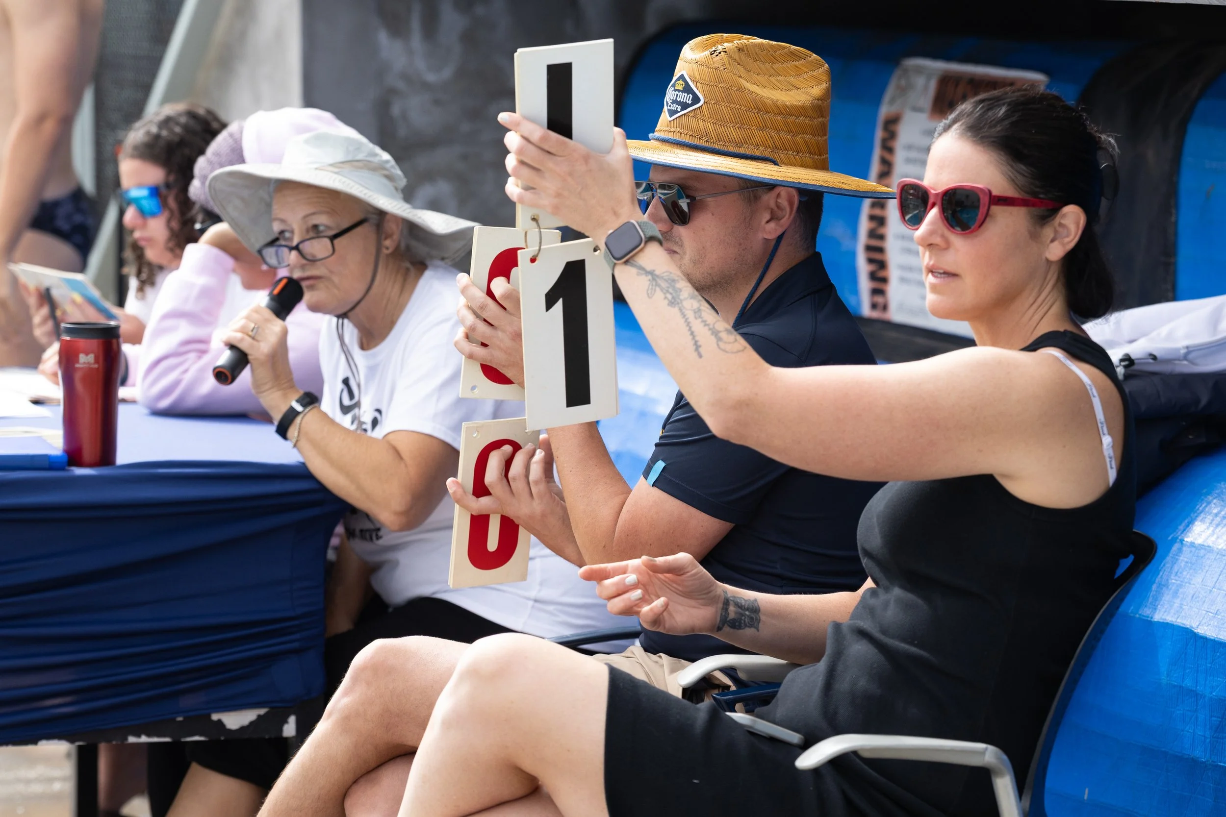  The diving judge announces the scores earned for a dive from the one-meter diving board during the Western State Conference (WSC) #3 Swimming and Diving Meet on Friday, March 27, 2026, at the Santa Monica College (SMC) Pool in Santa Monica, Calif. S