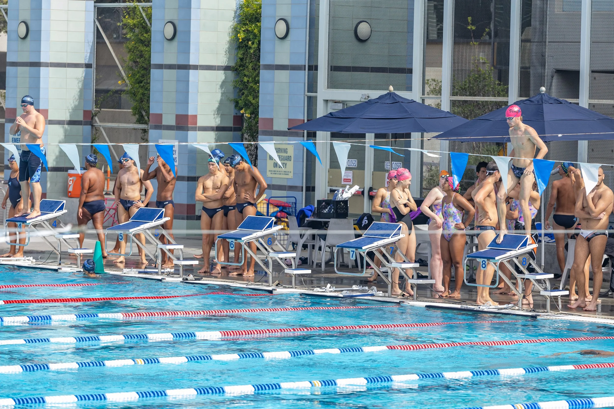  Swimming & Diving athletes wait for the kick-off event of 400 Medley Relay at the Western State Conference (WSC) #3 Swimming and Diving Meet on Friday, March 27, 2026, at the Santa Monica College (SMC) Pool in Santa Monica, Calif. SMC was hosting th