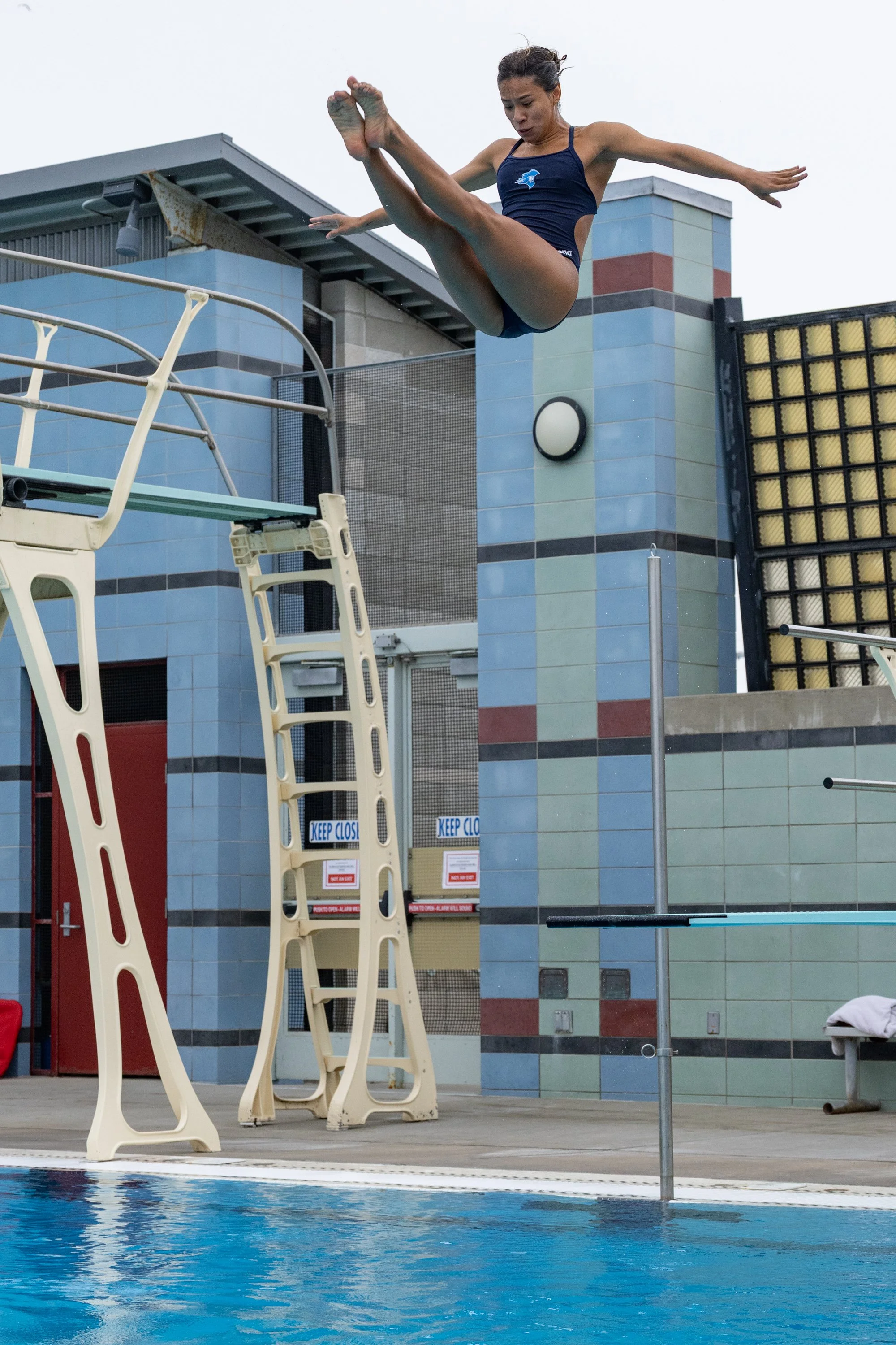  Karla Perez, Santa Monica College (SMC) Diving Corsair and a 2018 Youth Olympics Gymnast, dives from the one-meter diving board at warm-ups during the Western State Conference (WSC) #3 Swimming and Diving Meet on Friday, March 27, 2026, at the SMC P