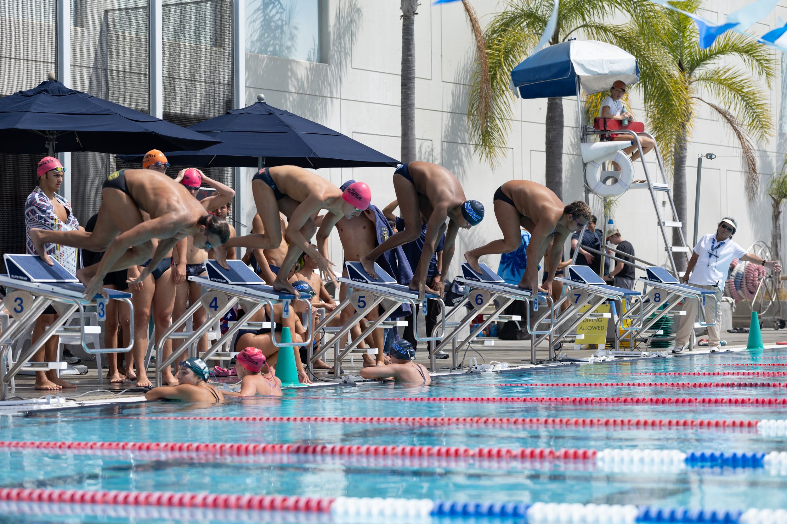  (L-R) Alex Kobalyan, Los Angeles Valley (LAVC) Monarch, Matthew Williams, Ventura Pirate, Anton Olsson, Santa Monica College (SMC) Corsair and Arman Tarakhchyan, LAVC Monarch, jump of the blocks for the Men’s 800 Freestyle Relay in the final event d