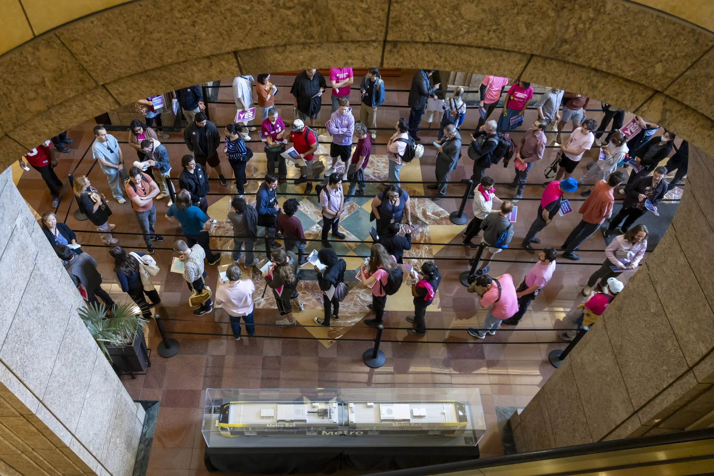  People wait in line inside One Gateway Plaza, the headquarters of the Los Angeles County Metropolitan Transit Authority (Metro), outside Union Station, Thursday, March 26, 2026 in Los Angeles. The Metro Board of Directors met Thursday, bringing a co