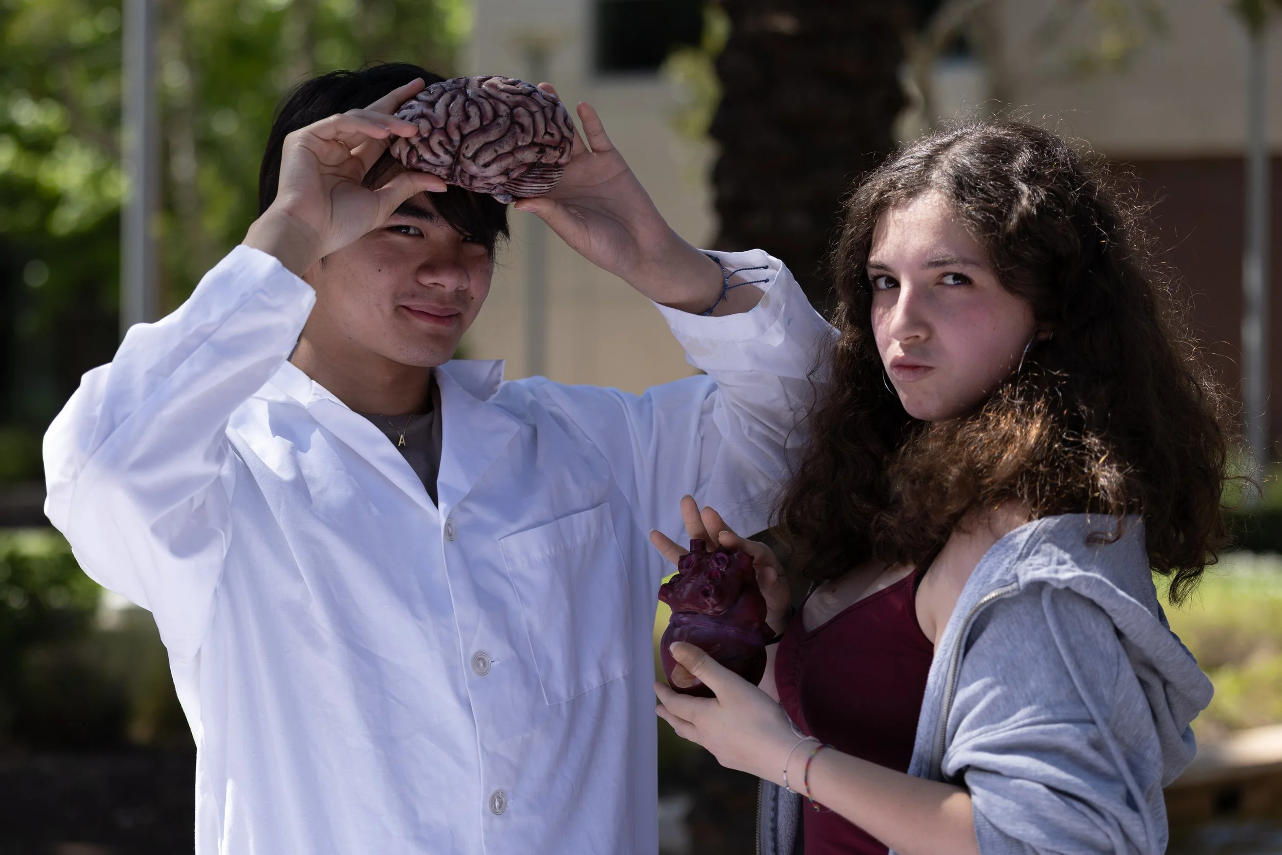  Pre-Health Professional Association (PHPA) club members, August Sriwattananon (cq) (L) and Carlotta Profera (R) pose with a brain and a heart at Santa Monica College (SMC) Club Awareness event on the Quad of the SMC Main Campus in Santa Monica, Cali