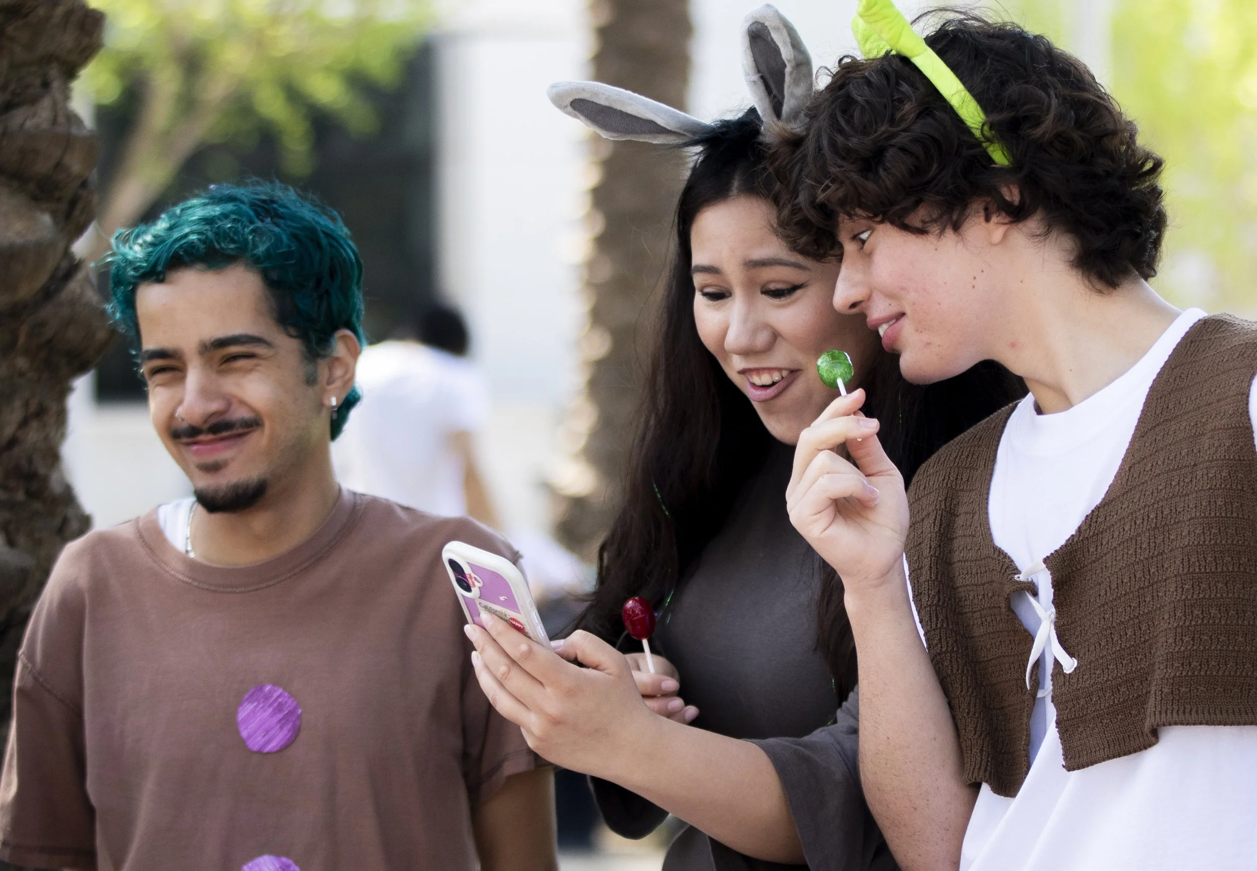  Santa Monica College (SMC) students Brandon Cordova, (left) Miranda Berenise Porras, (cq.) (center) and Franco Diaz Raffo (right) dressed as characters from Shrek for their club theme at the Club Awareness Day at the SMC main campus on Thursday, Mar