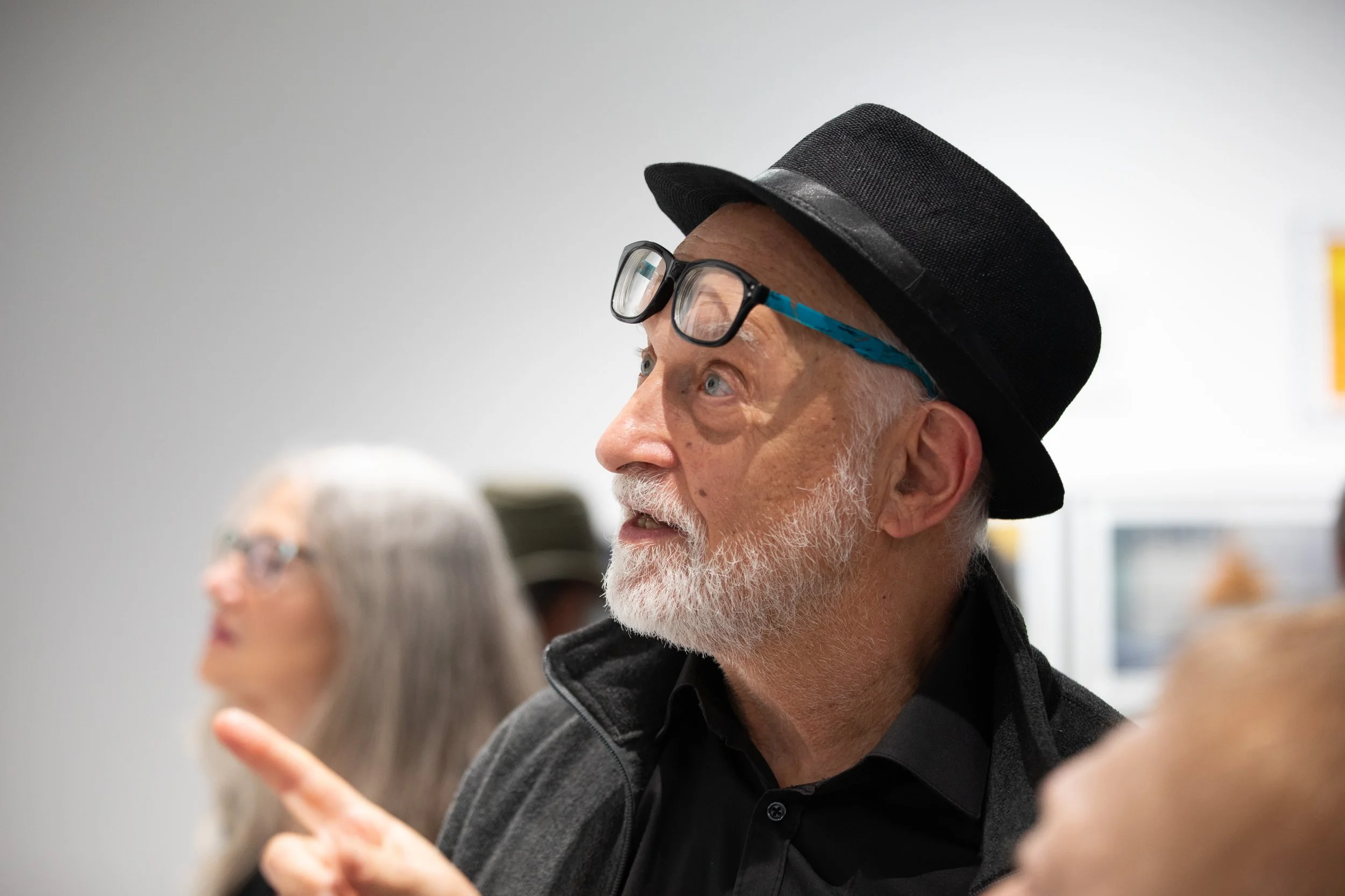  Martin Cohen, a photography teacher, looks at a photograph during the 2026 Annual Student Photography Exhibition at the Santa Monica College Emeritus Art Gallery in Santa Monica on Thursday, March 15, 2026. (Kantapong Wongjirasawad | The Corsair) 