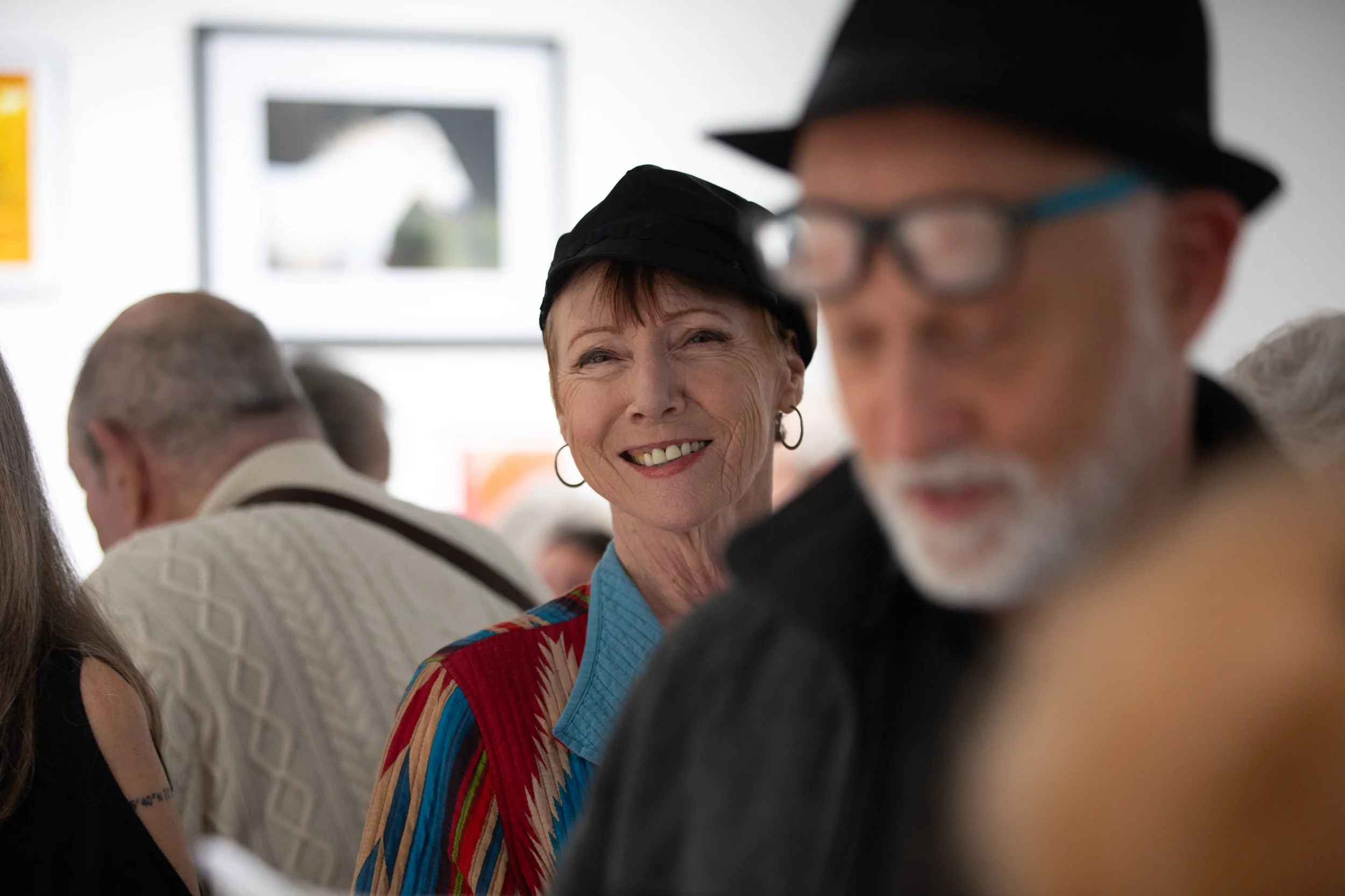  Diana Andrew, center, a photographer and student whose work is featured in the exhibition, participates in the 2026 Annual Student Photography Exhibition at the Santa Monica College Emeritus Art Gallery in Santa Monica on Thursday, March 15, 2026. (