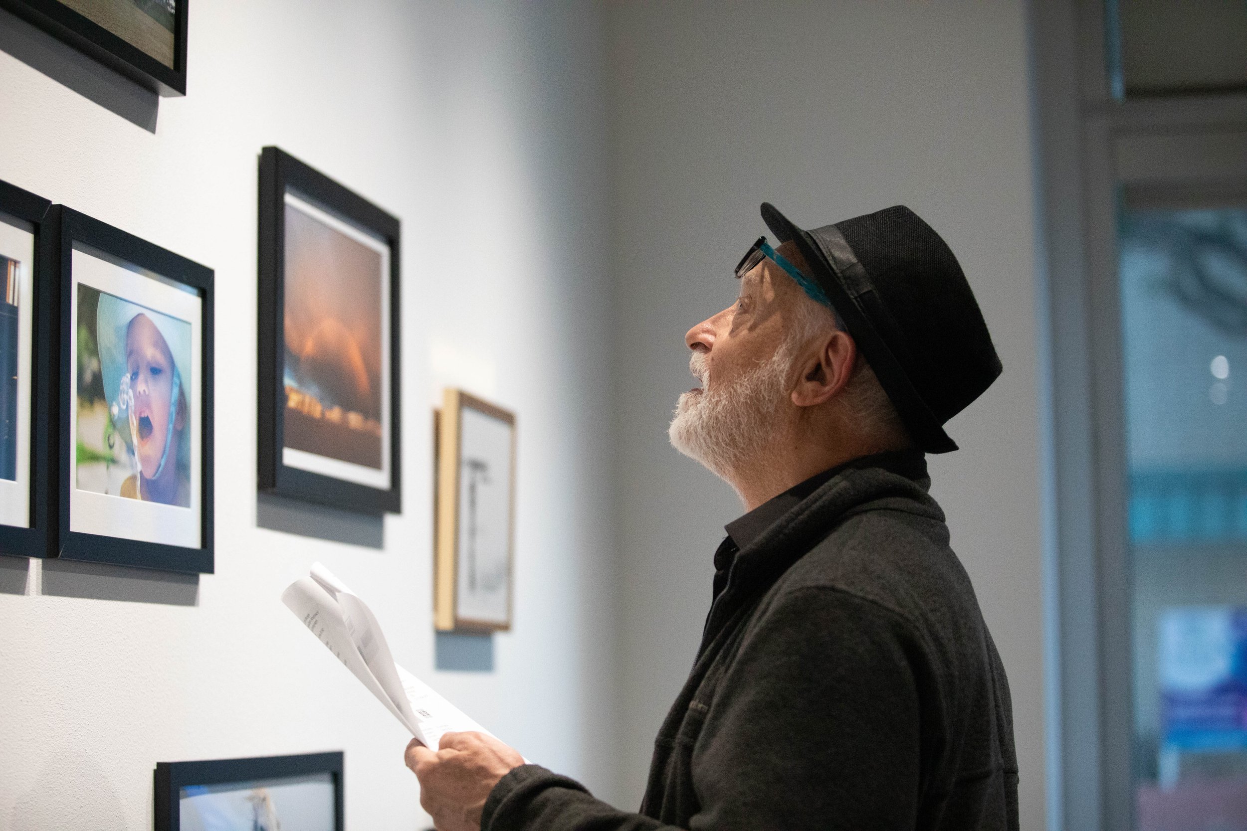  Santa Monica College (SMC) photography professor Martin Cohen studies his students' works displayed at the SMC Emeritus Student Photography Exhibition in Santa Monica, CA, Thursday, March 5, 2026 (Maria Lebedev | The Corsair) 