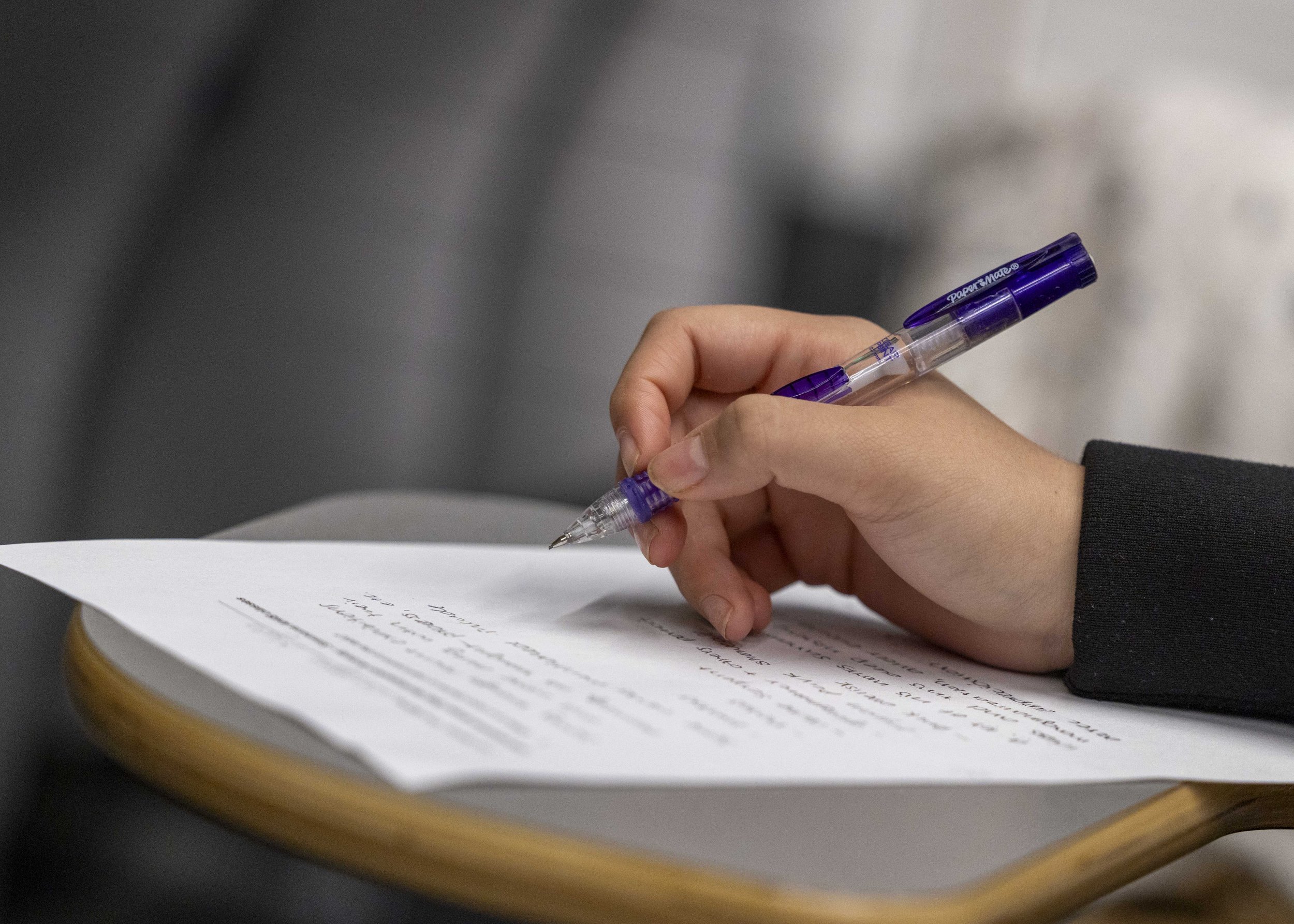  Santa Monica College (SMC) student takes notes during a special event featuring Mexican American multidisciplinary performance artist Rafa Esparza at the SMC Student Services Center Orientation Hall in Santa Monica, Calif., on Wednesday, March 11, 2