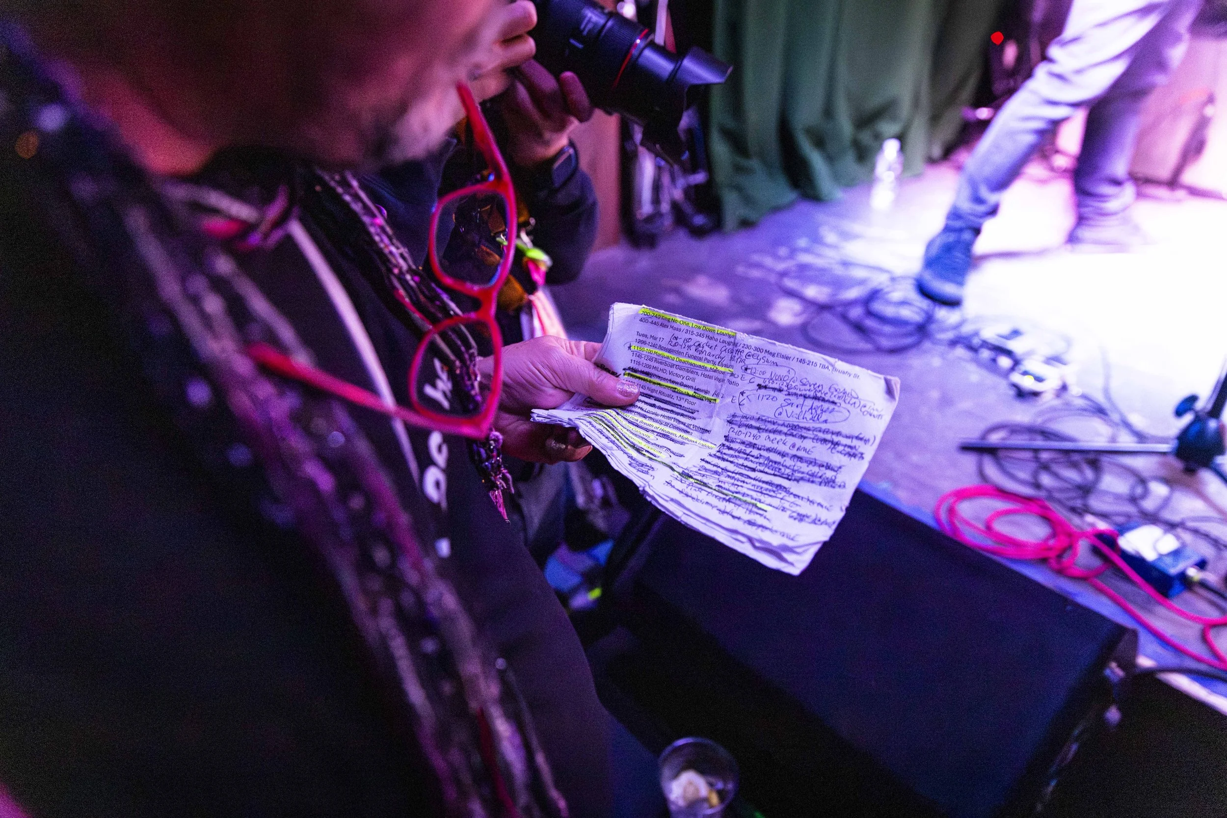  An attendee at a South by Southwest (SXSW) music showcase at 13th Floor checks his schedule on Tuesday, March 17, 2026, in Austin, Texas. With more than 1,000 music showcases and hundreds of bands performing day and night over a seven-day period, at