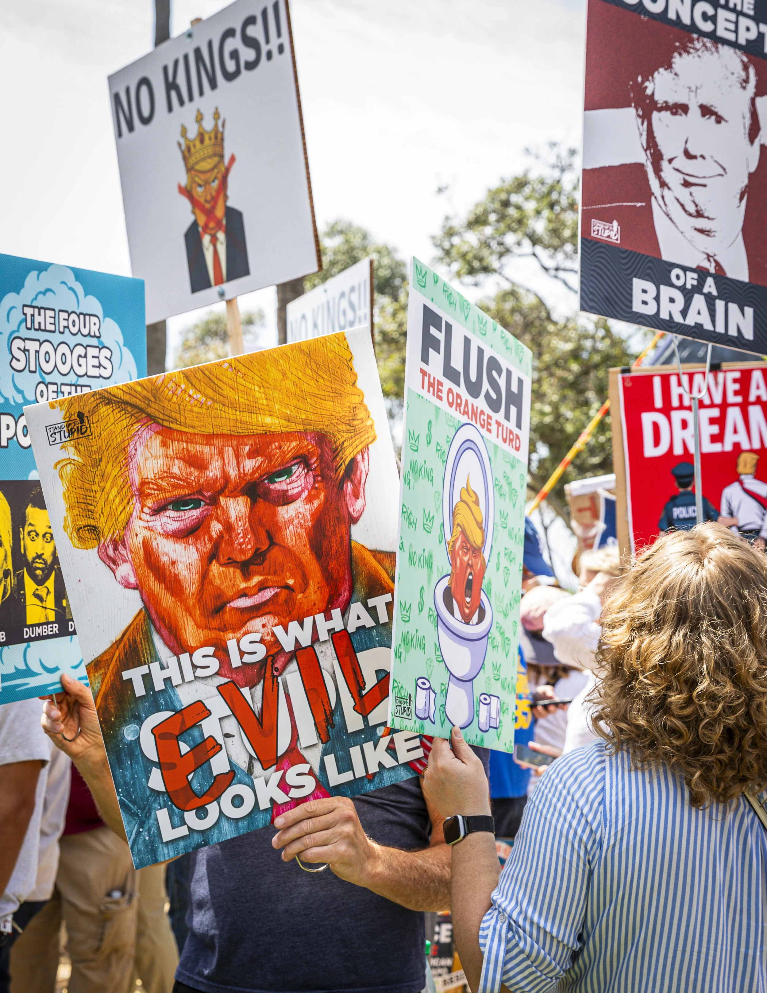  Protesters brought all sorts of signs to the “No Kings 3” rally on Palisades Park at Ocean Ave. and Montana Ave. on Saturday, March 28th, 2026, in Santa Monica, Calif. The protest, part of a nationwide movement opposing policies of President Donald 