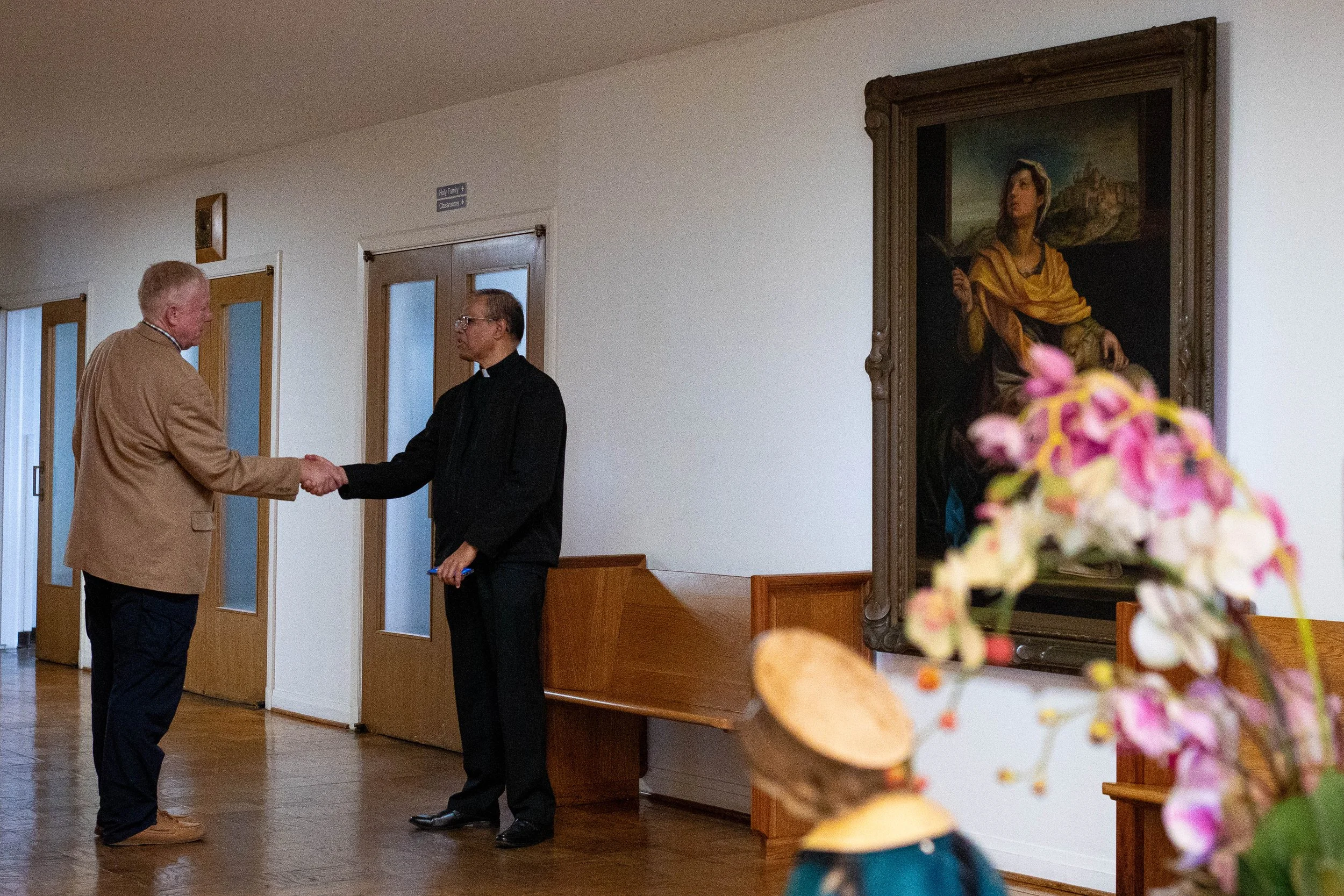  Father Valerian Menezes, an associate pastor for Corpus Christi Church who began his Los Angeles ministry in 2017, greets a parishioner following Easter Sunday Mass at St. Joseph’s Chapel in Los Angeles, Calif., Sunday, April 5, 2026. The congregati