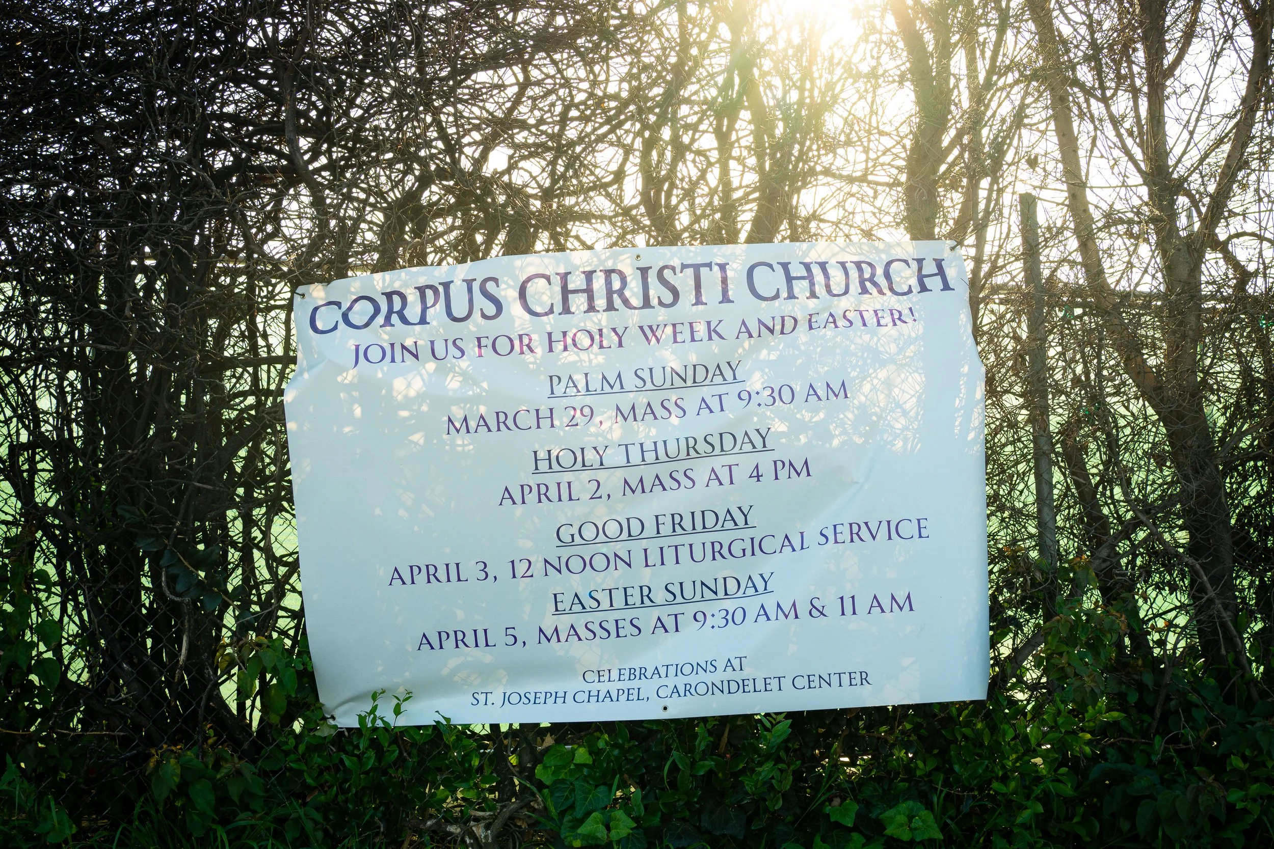  A banner providing updated service locations hangs on the perimeter fence of the original Corpus Christi Church in Pacific Palisades, Monday, April 6, 2026, in Los Angeles, Calif. The sign directs the congregation to St. Joseph’s Chapel at the Caran