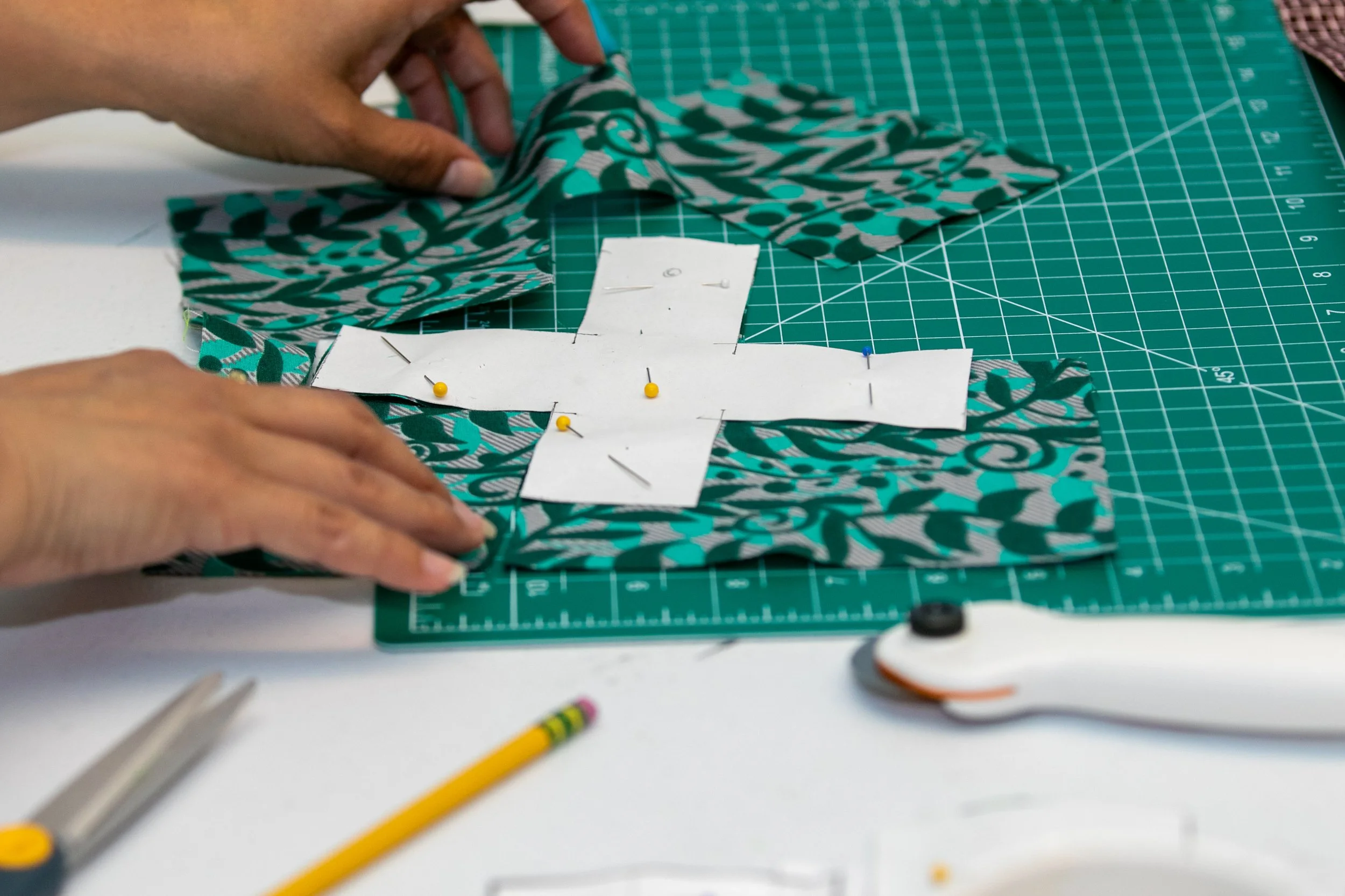  Santa Monica College personnel is cutting out the excess fabric around the stencil during the Black Collegians Quilting Circle reunion on Thursday, April 2, 2026, at the Student Service Center, Santa Monica College, Santa Monica. Calif,. 