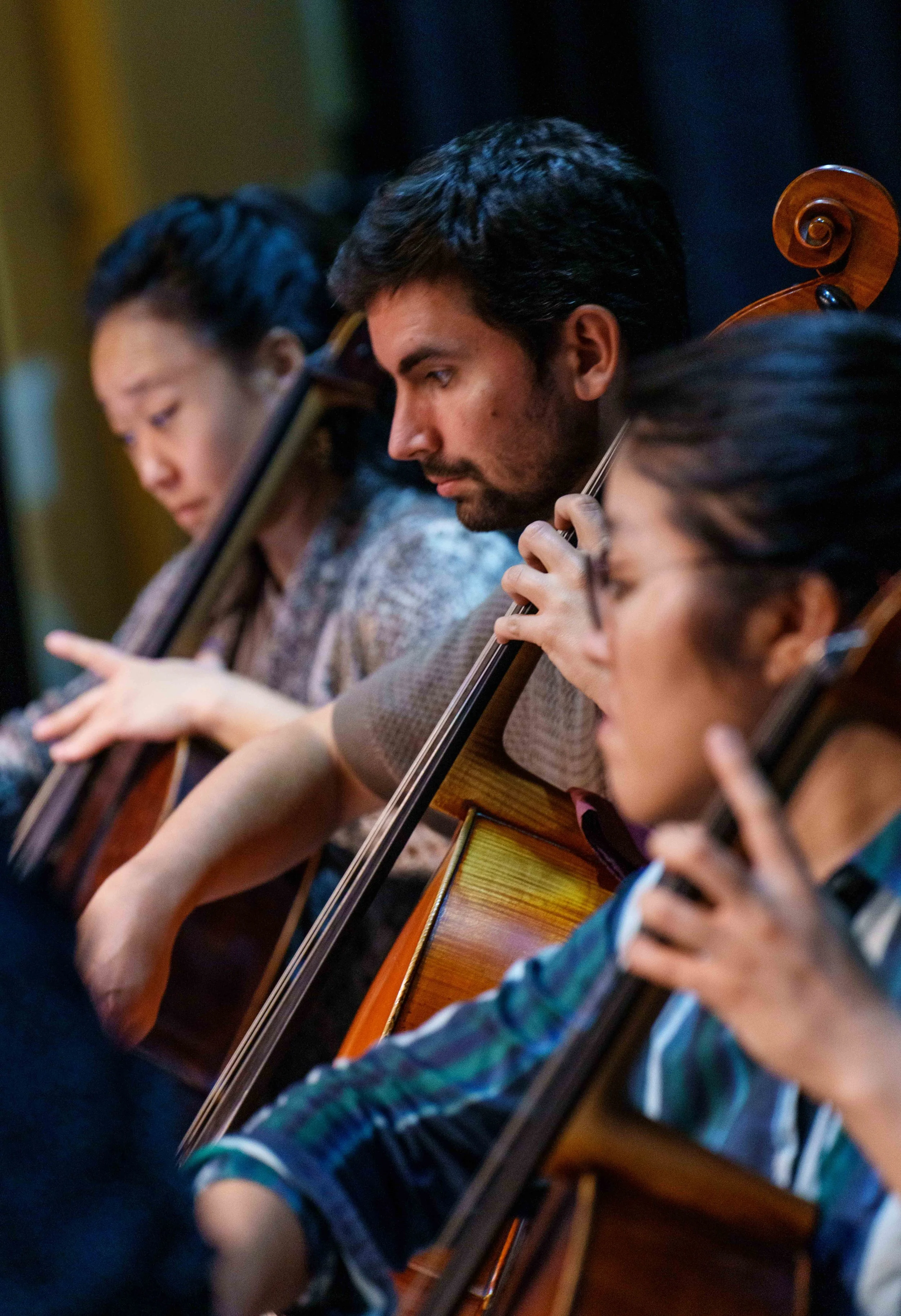  (L-R) Cellists Joo Lee, Javier Iglesias Martin, and principal Stella Cho rehearse Bach's Brandenburg Concerto No. 3 at Théâtre Raymond Kabbaz in Los Angeles, Wednesday, March 25, 2026. (Elizabeth Bacher | The Corsair) 