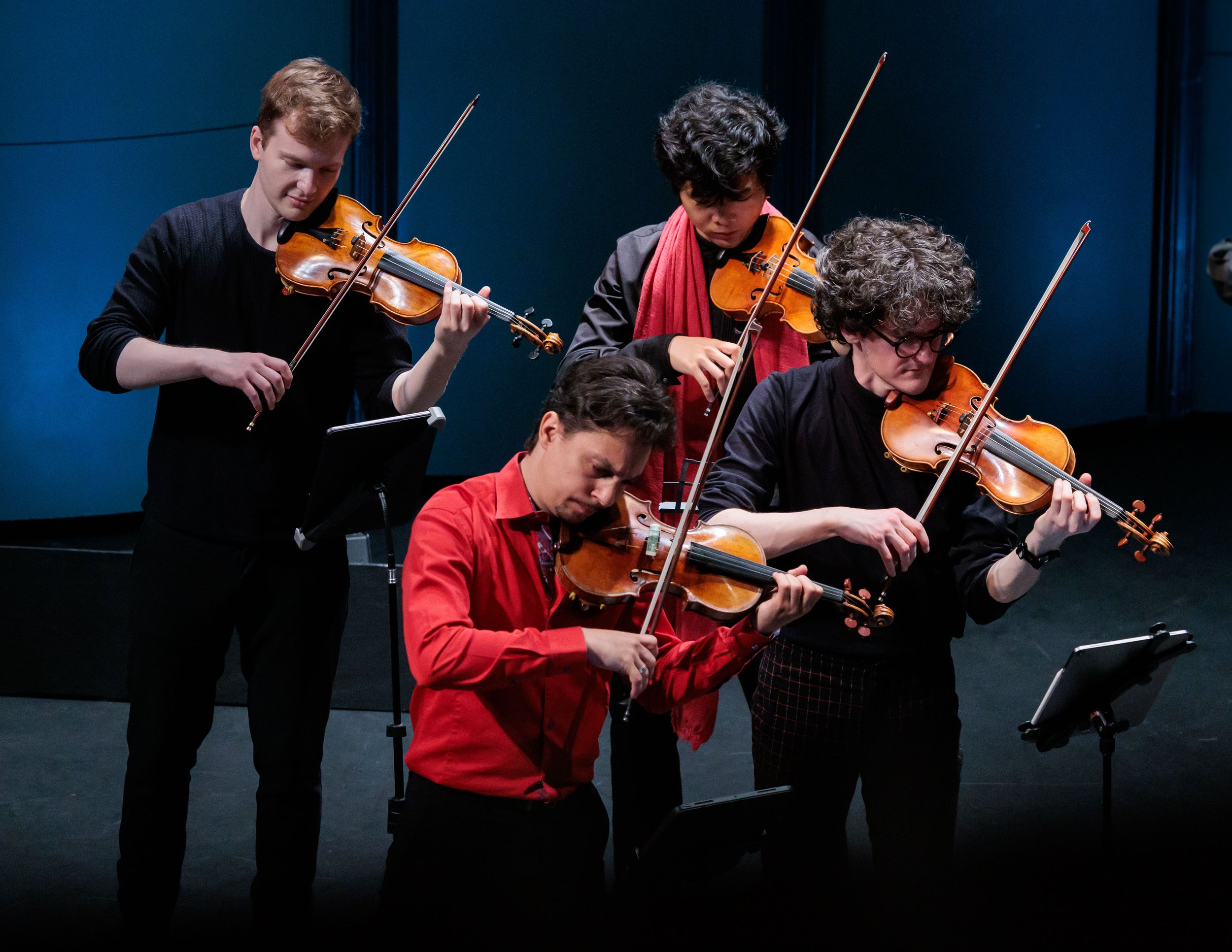  (Clockwise from top L) Delirium Musicum violinists Misha Vayman, Juchao Zhao, Evan Hjort and leader Etienne Gara perform Mussorgsky's Pictures at an Exhibition at BroadStage, Sunday, March 29, 2026, in Santa Monica, Calif. Hjort said, "I don't want 