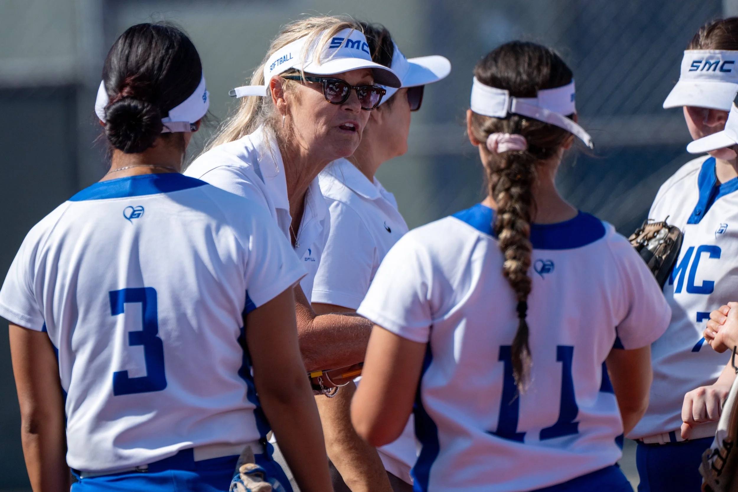  Santa Monica College Corsair Coach Christine Druckman discusses strategy during a break at the mound during a game against the Santa Barbara City College Vaqueros in Santa Monica, Calif., on April 7, 2026. The Corsairs fell to the Vaqueros, 12-3. (T