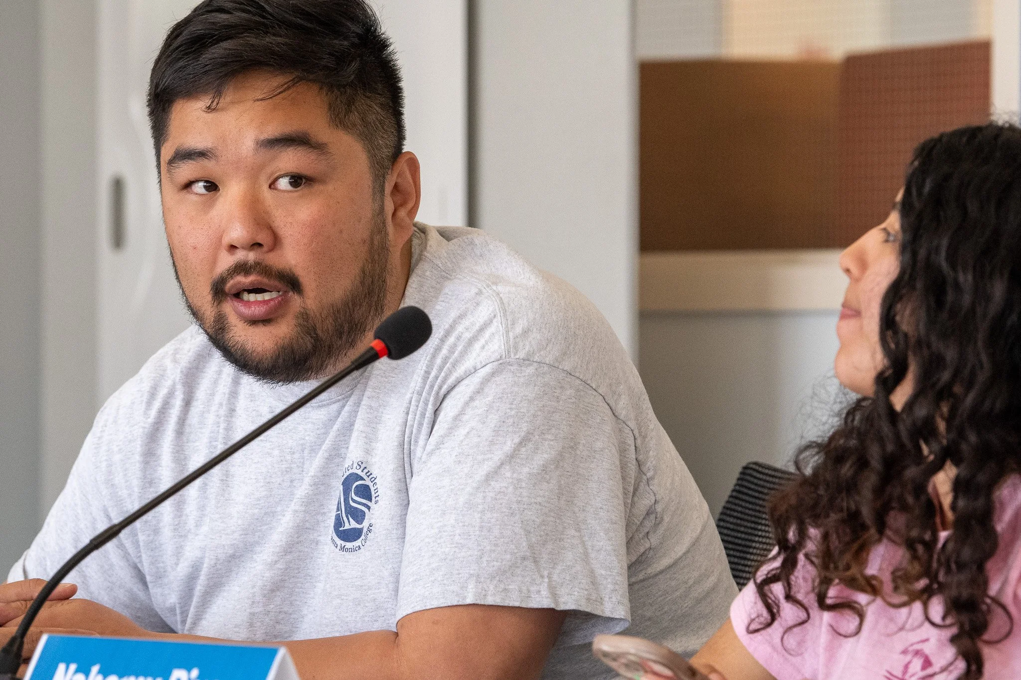  (L-R) Santa Monica College Associate Dean for Student Life, Thomas Bui and Associated Students Director of Student Activies, Nahomy Rivas discussing funds for the Indigenous Scholars Club during the Associated Students Board of Directors meeting at 