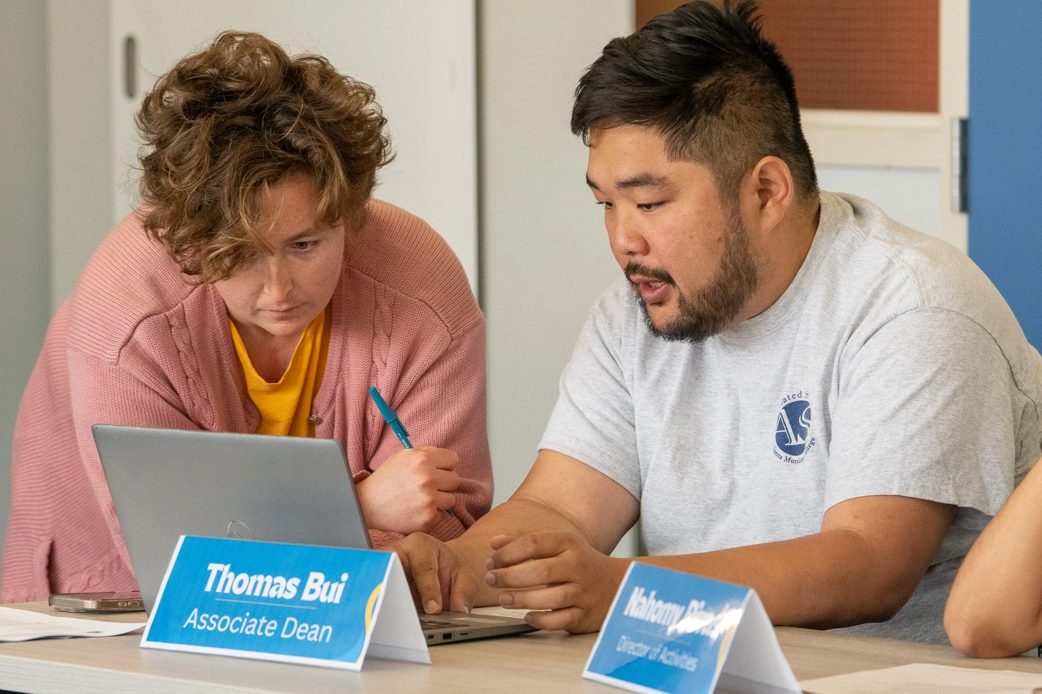  (L-R) Santa Monica College Club Grow President Lulu Octeau consulting Associate Dean of Student Life, Thomas Bui on navigating forms for club funding during the Associated Students Board or Directors meeting held at Cayton Center in Santa Monica, Ca