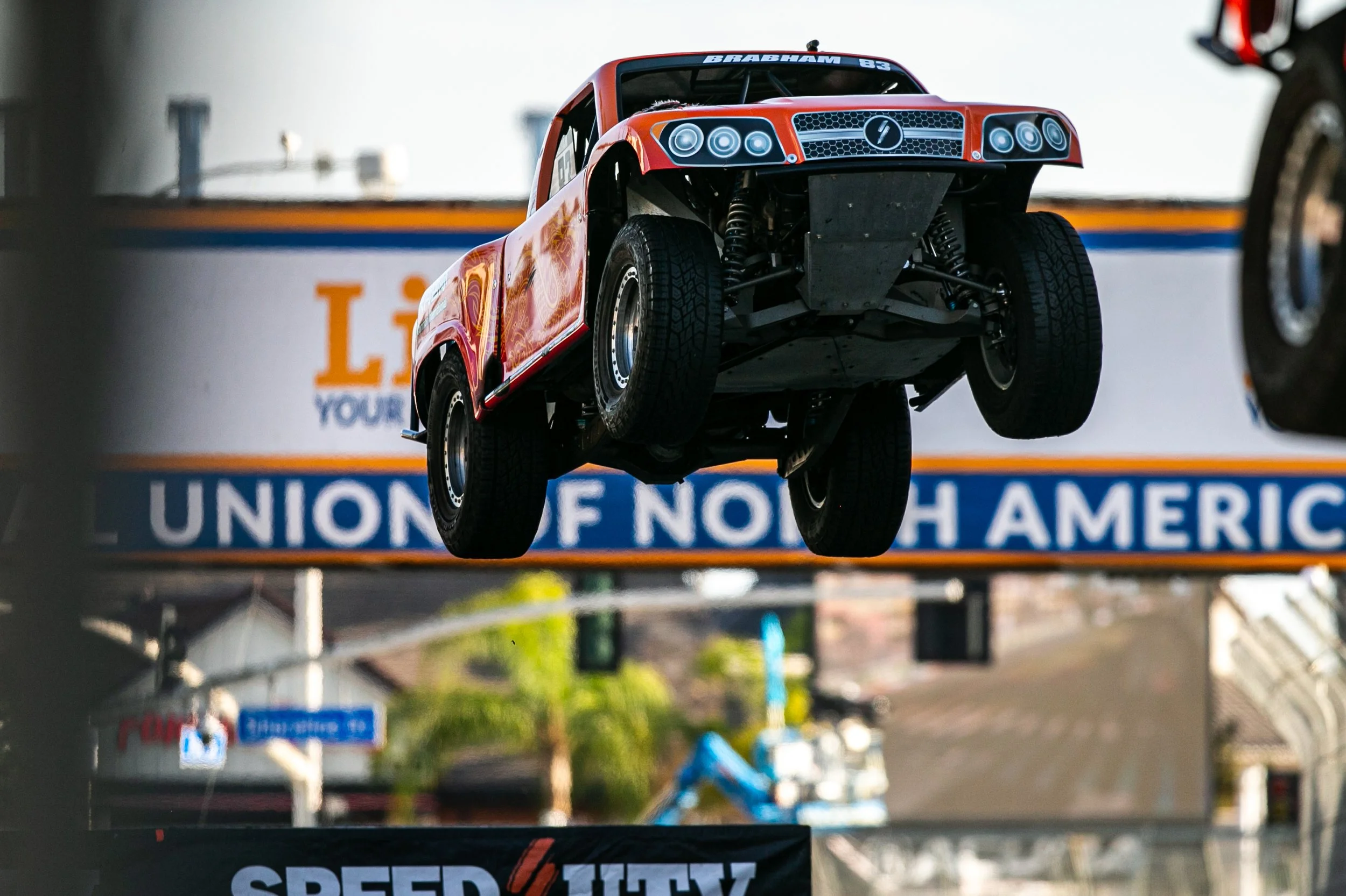  Super Stadium Truck Number 83, driven by Matt Brabham jumping his truck over a ramp set up by the Acura Grand Prix of Long Beach during Race 1 on Saturday, April 18, 2026, on Pine Ave, Long Beach, Calif. Brabham did not finish race 1 due to a mechan