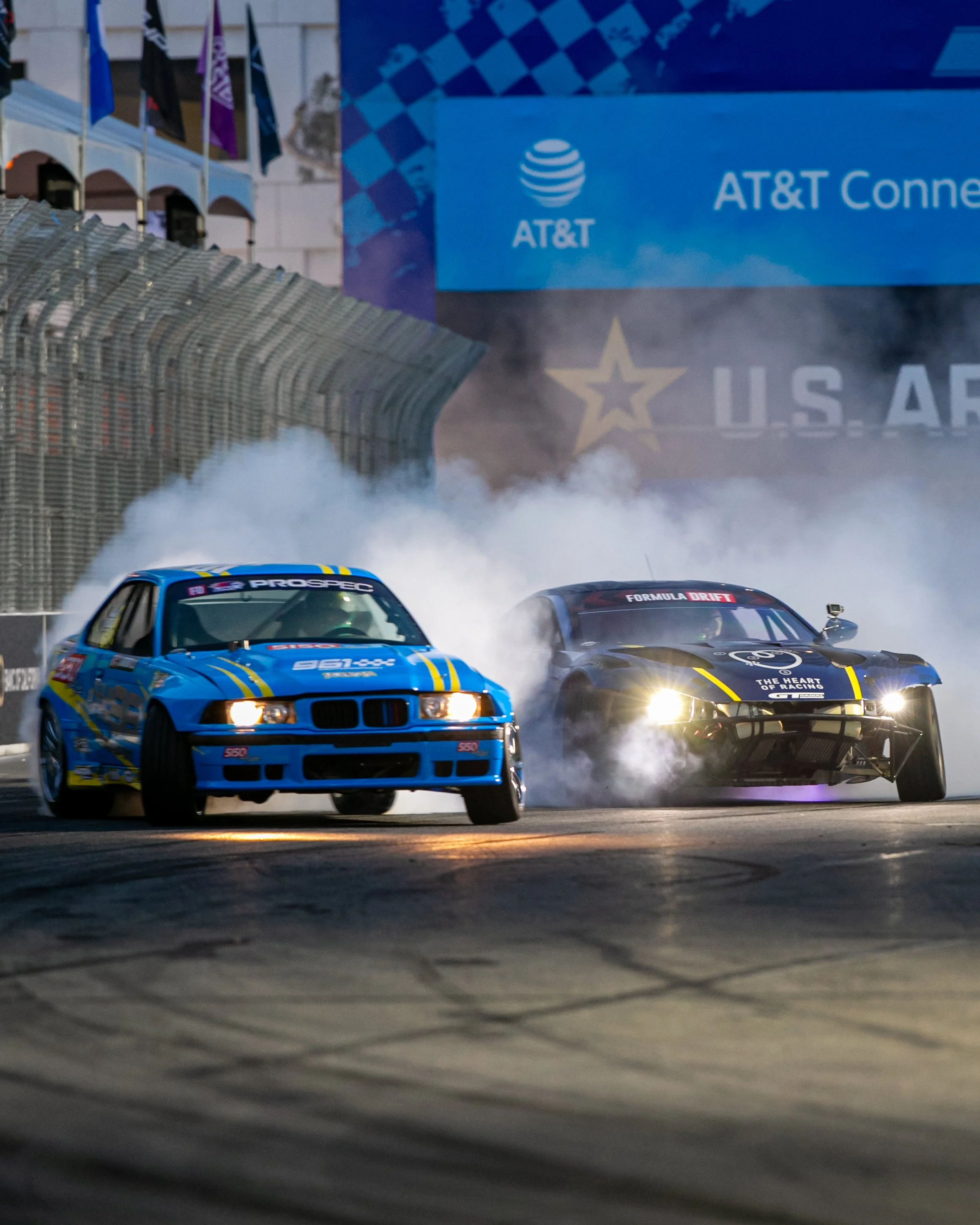  Formula Drift driver Sam Maghmoumi in his 961 Motorsport E36 BMW, drifting in tandem with Aurimas “Odi” Bakchis in his The Heart of Racing Aston Martin Vantage V12 during Formula Drift challenge 2 on Saturday, April 18, 2026, at the Long Beach Conve
