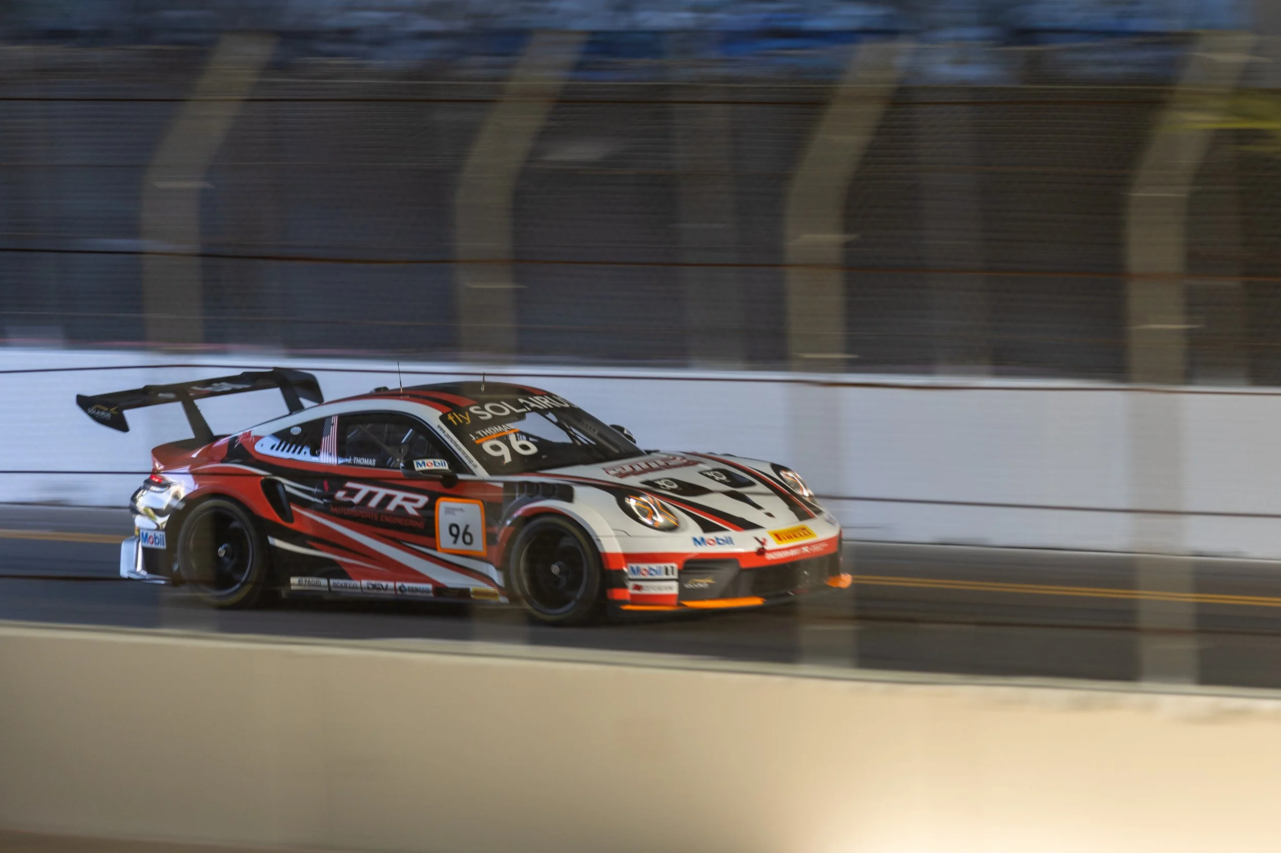 JTR Motorsports Engineering Porsche 911 Cup Type 992.2 Number 96 Pro driven by Jared Thomas, driving under the Long Beach Convention entrance bridge during Practice 1 of the Porsche Carrera Cup  North America series on Friday, April 17, 2026, on Sea