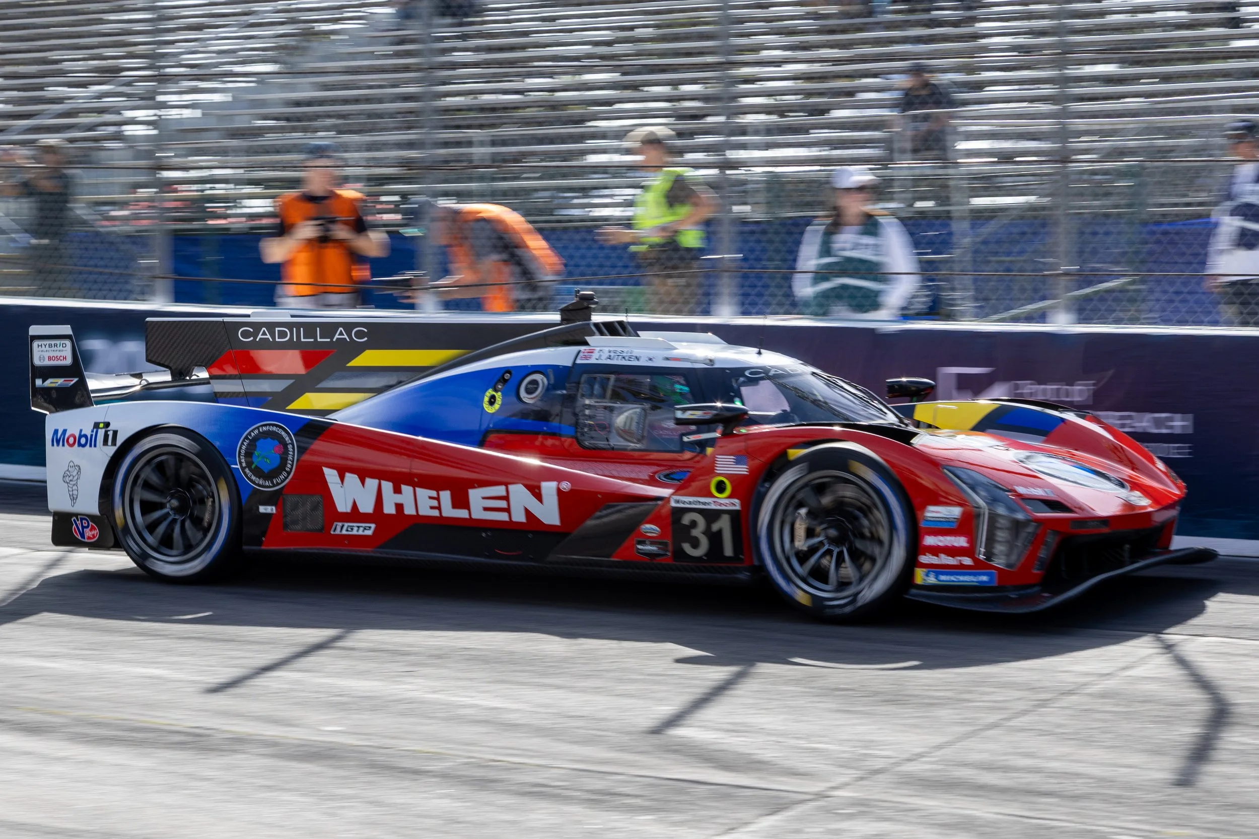  Grand Touring Prototype (GTP) Whelen Cadillac V-Series.R Number 31 driven by Jack Aitken (CQ) and Frederik Vesti (CQ) exiting turn 11 during Practice 1 in the International Motor Sports Association (IMSA) WeatherTech Sportscar Series on Friday, Apri