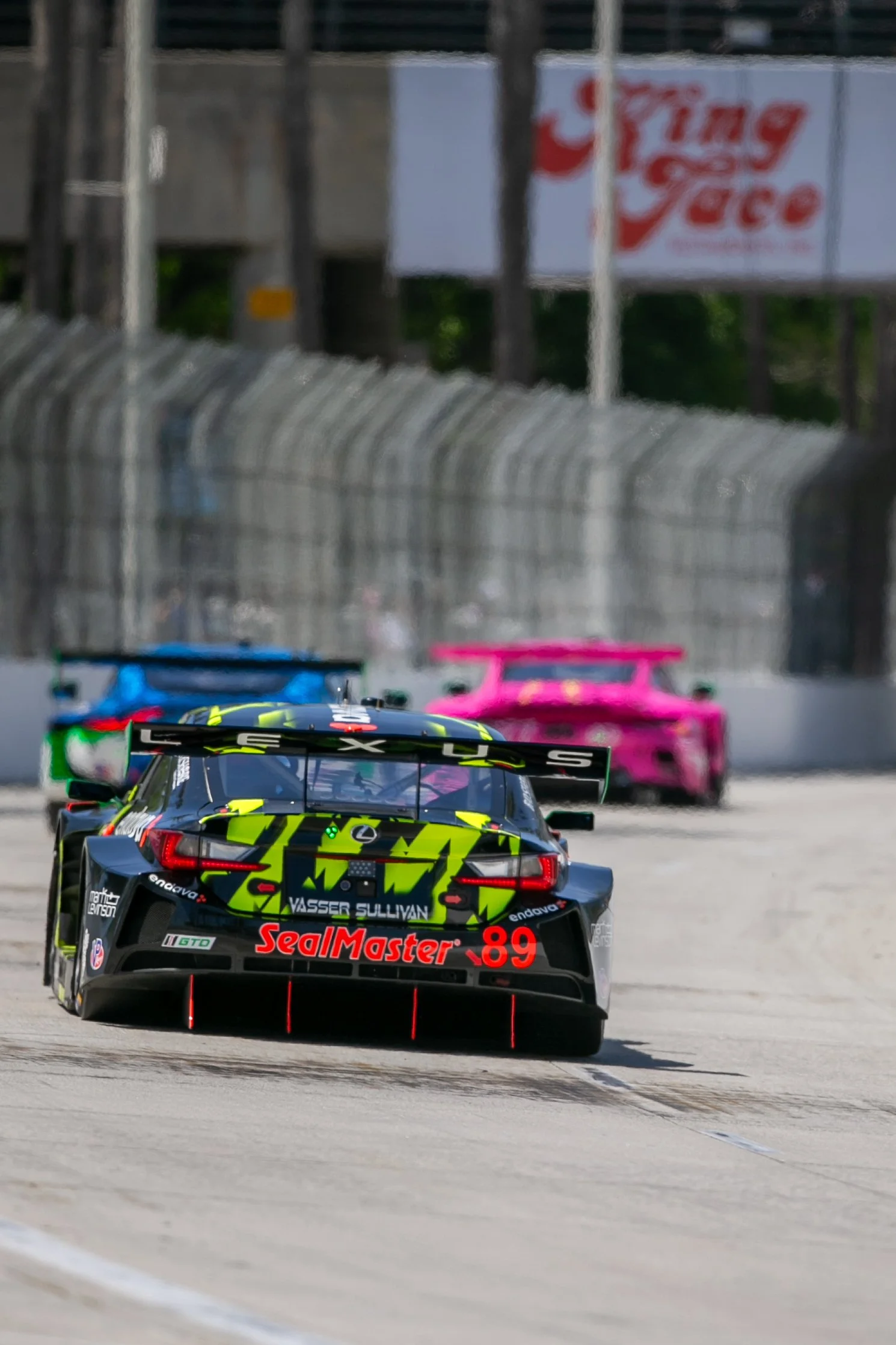  Grand Touring Daytona (GTD) Vasser Sullivan Racing Lexus RC F GT3 number 89 driven by Jack Hawksworth and Frankie Montecalvo (CQ) chasing down GTD van der Steur Racing Aston Martin Vantage GT3 Evo number 19 driven by Rory van der Steur (CQ) and Vale